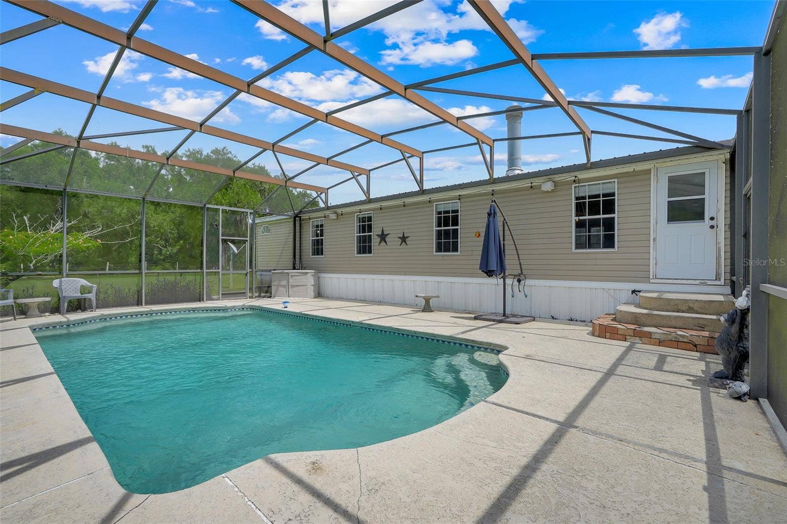 21301 QUAIL HAMMOCK LANE, Groveland, FL 34736 Pool attached to the mobile home