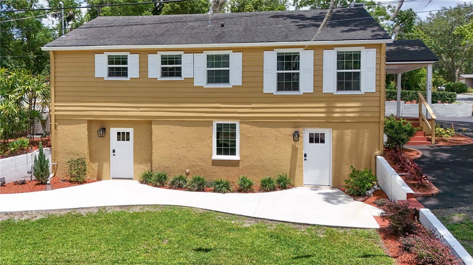 102 N CLAYTON STREET, Mount Dora, FL 32757 Side of Home