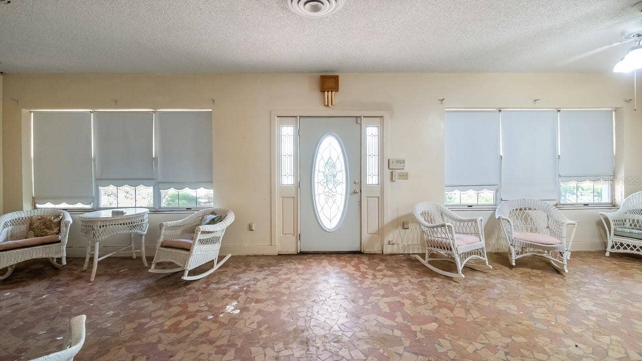 127 E LAUREL AVENUE, Howey In The Hills, FL 34737 Front enclosed porch with terrazzo flooring