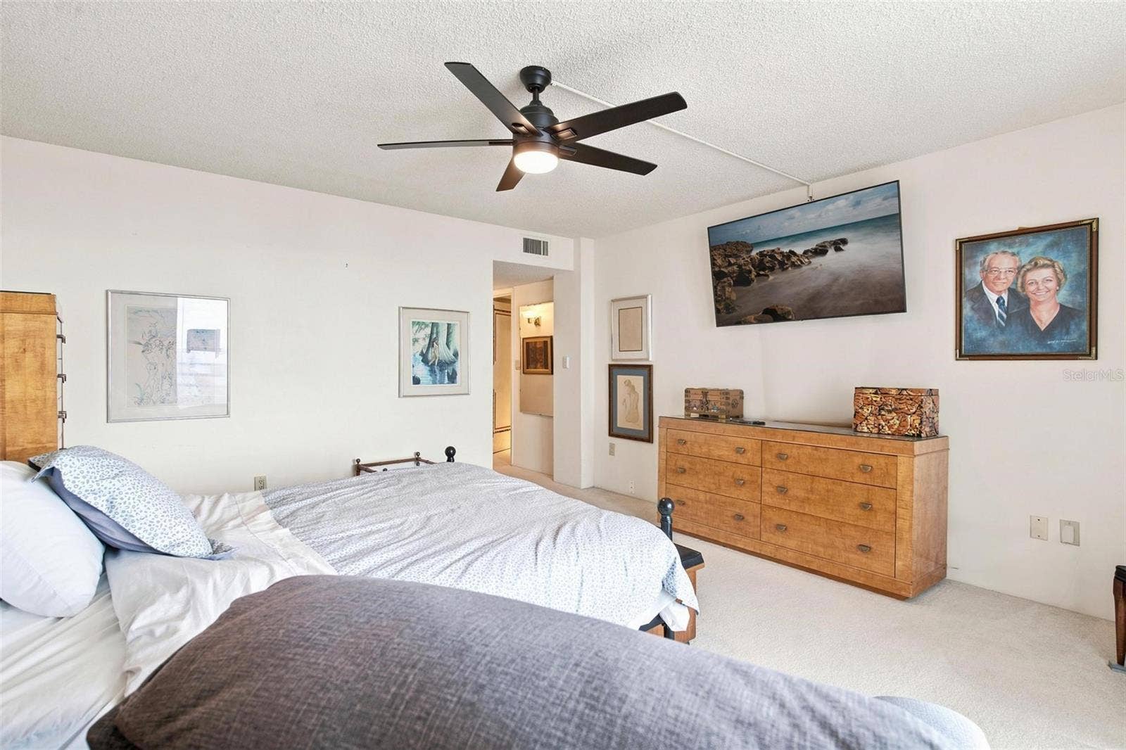 395 S ATLANTIC AVENUE, #402, Ormond Beach, FL 32176 Primary bedroom suite features primary bath, walk in closet, and balcony with ocean views.