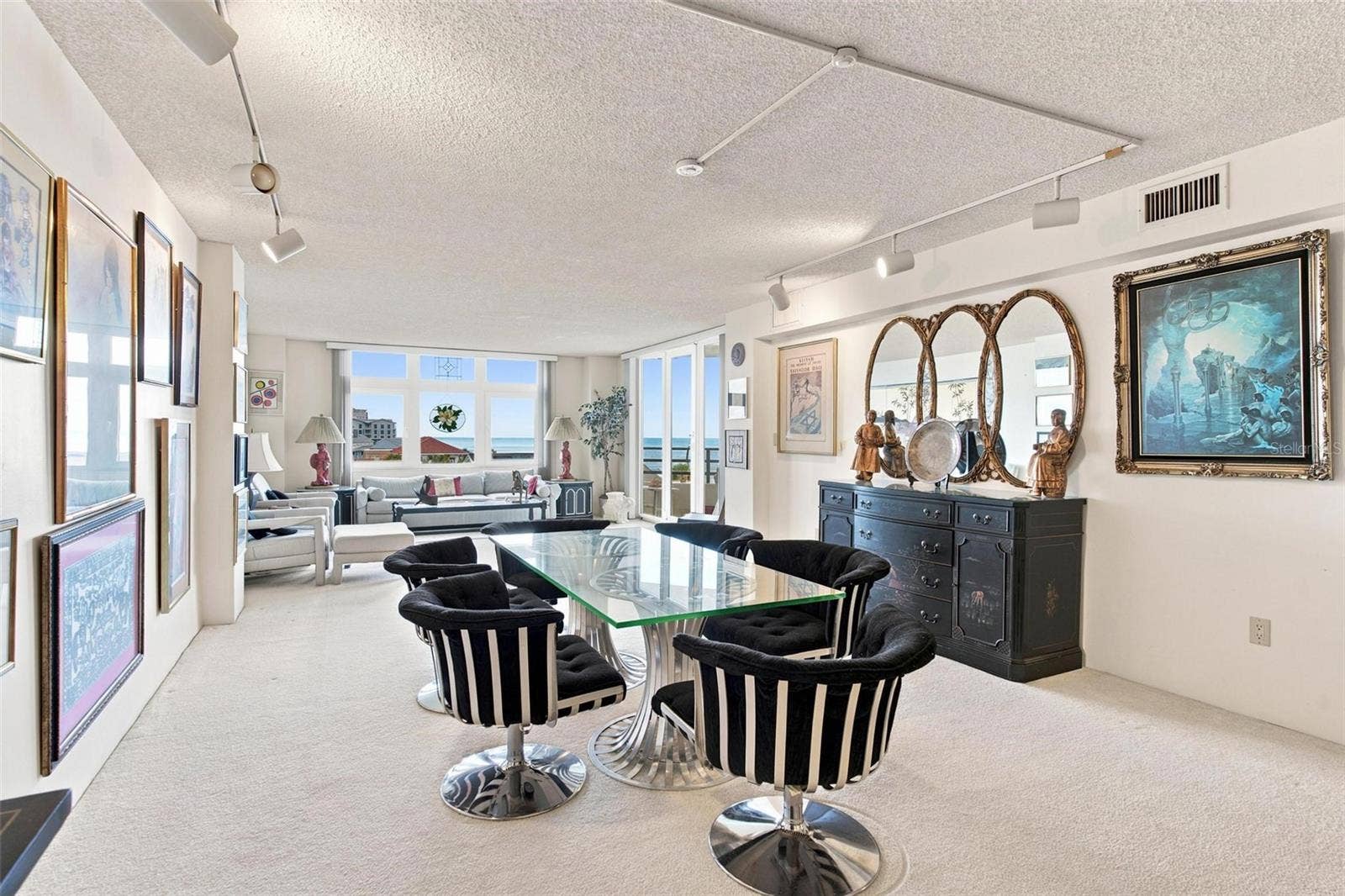 395 S ATLANTIC AVENUE, #402, Ormond Beach, FL 32176 Open Living Space. Dining and Living Area with sliders leading to balcony with ocean view.