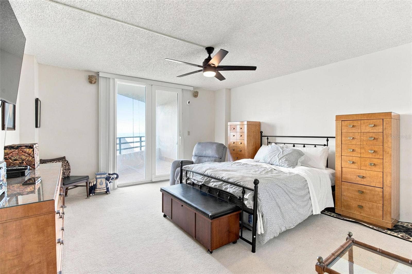 395 S ATLANTIC AVENUE, #402, Ormond Beach, FL 32176 Primary bedroom suite features primary bath, walk in closet, and balcony with ocean views.