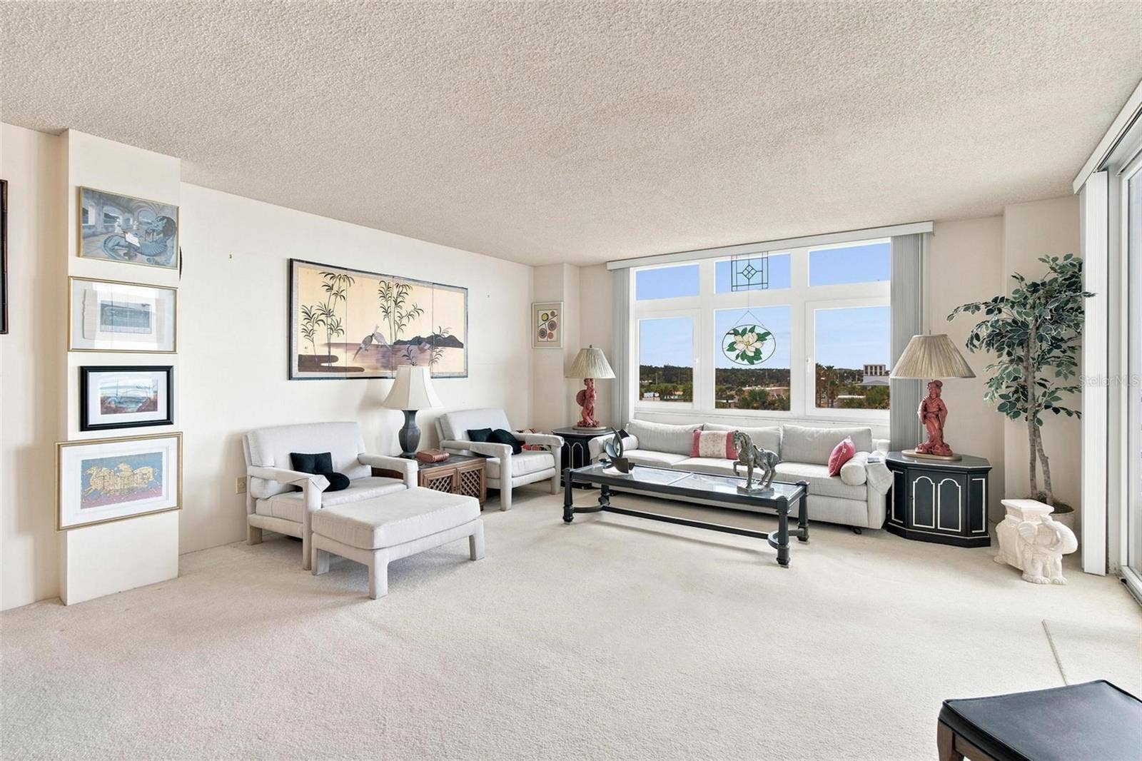 395 S ATLANTIC AVENUE, #402, Ormond Beach, FL 32176 Open Living Space. Dining and Living Area with sliders leading to balcony with ocean view.