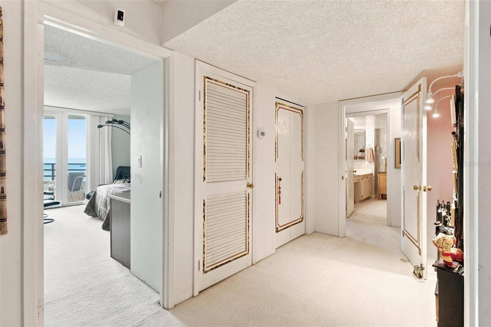 395 S ATLANTIC AVENUE, #402, Ormond Beach, FL 32176 Hallway leading to both bedrooms
