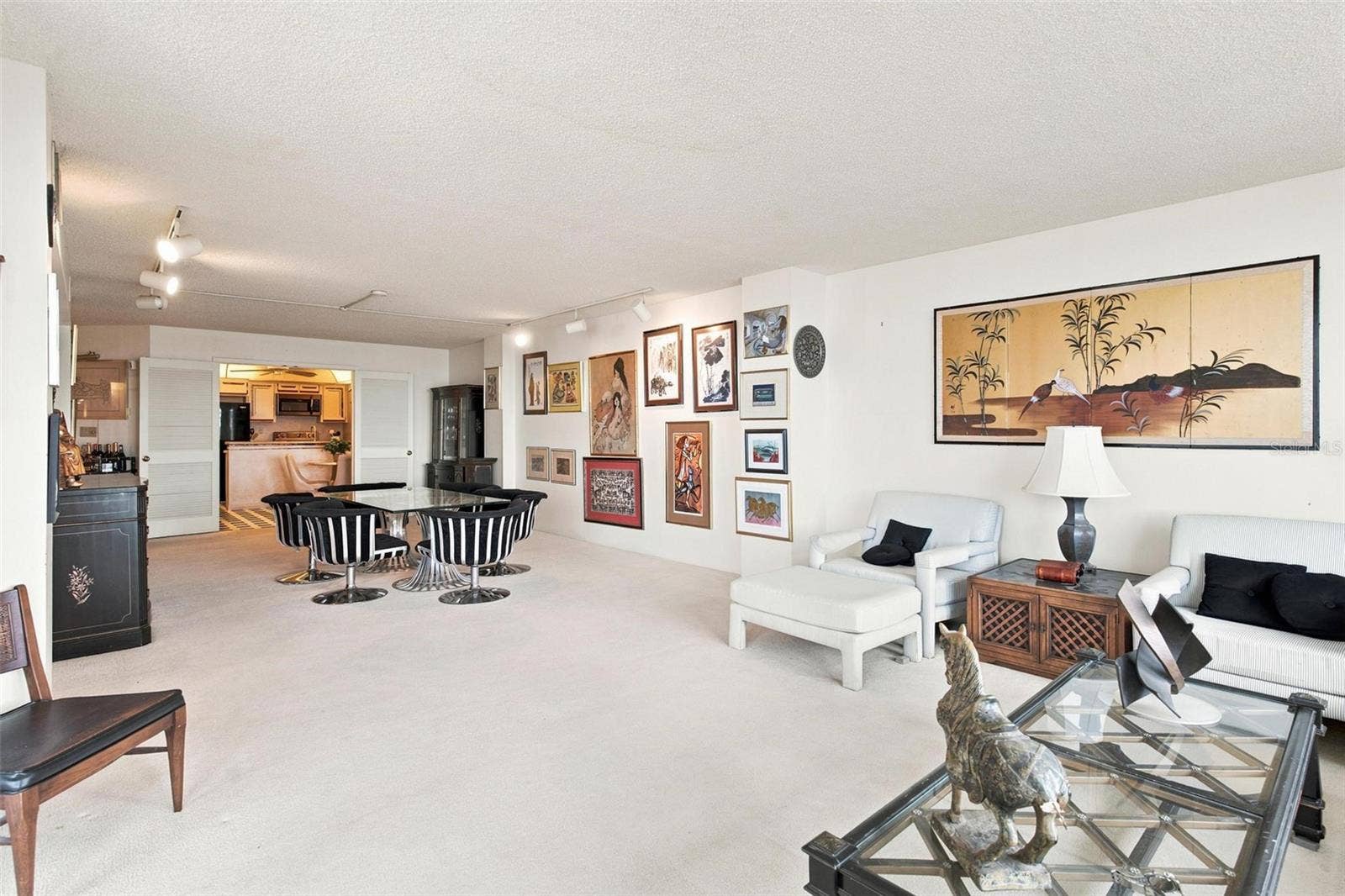 395 S ATLANTIC AVENUE, #402, Ormond Beach, FL 32176 Open Living Space. Dining and Living Area overlook Kitchen and has sliders leading to balcony with ocean view.