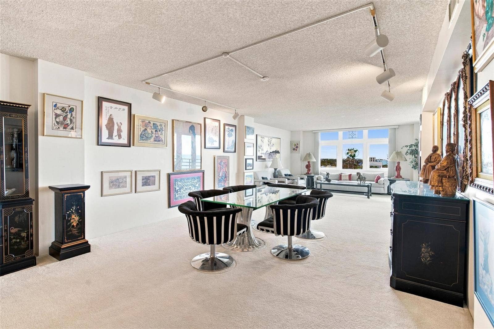 395 S ATLANTIC AVENUE, #402, Ormond Beach, FL 32176 Open Living Space. Dining and Living Area overlook Kitchen and has sliders leading to balcony with ocean view.