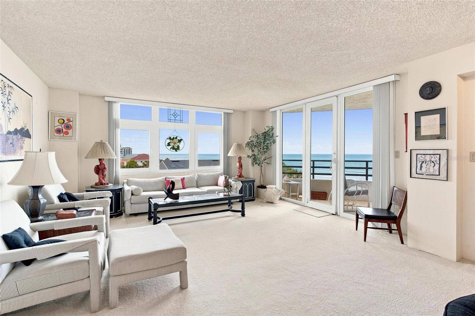 395 S ATLANTIC AVENUE, #402, Ormond Beach, FL 32176 Open Living Space. Dining and Living Area with sliders leading to balcony with ocean view.