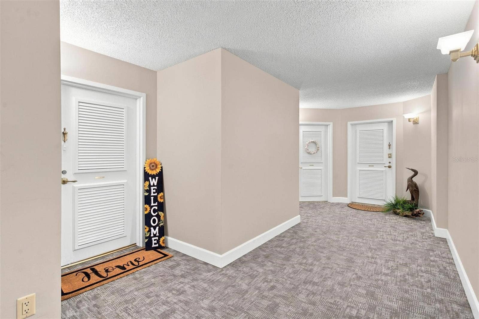 395 S ATLANTIC AVENUE, #402, Ormond Beach, FL 32176 Hallway leading to front entry of condo