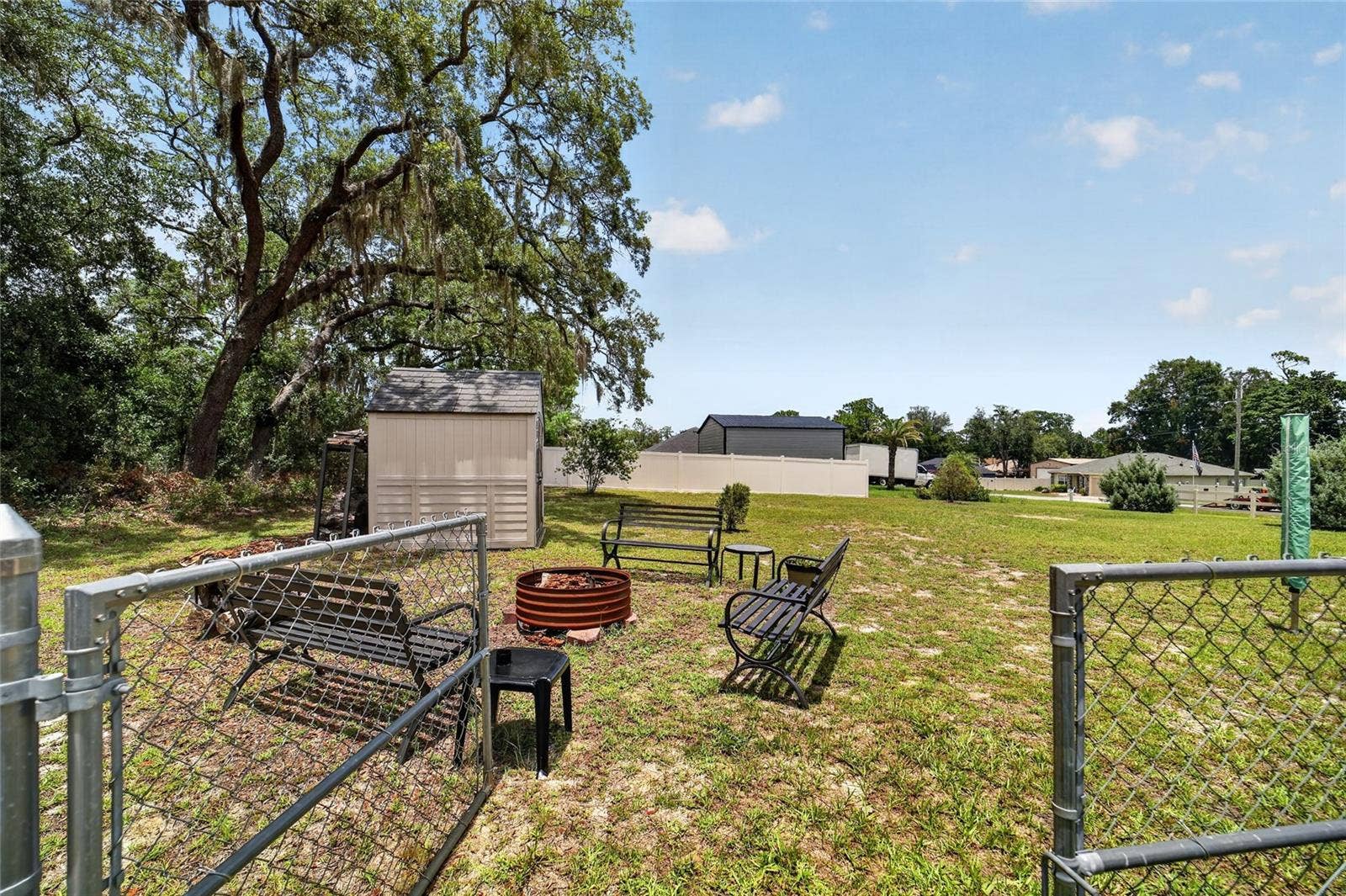 16364 SE 89TH TERRACE, Summerfield, FL 34491 Gate to extra lot with fire pit and additional shed