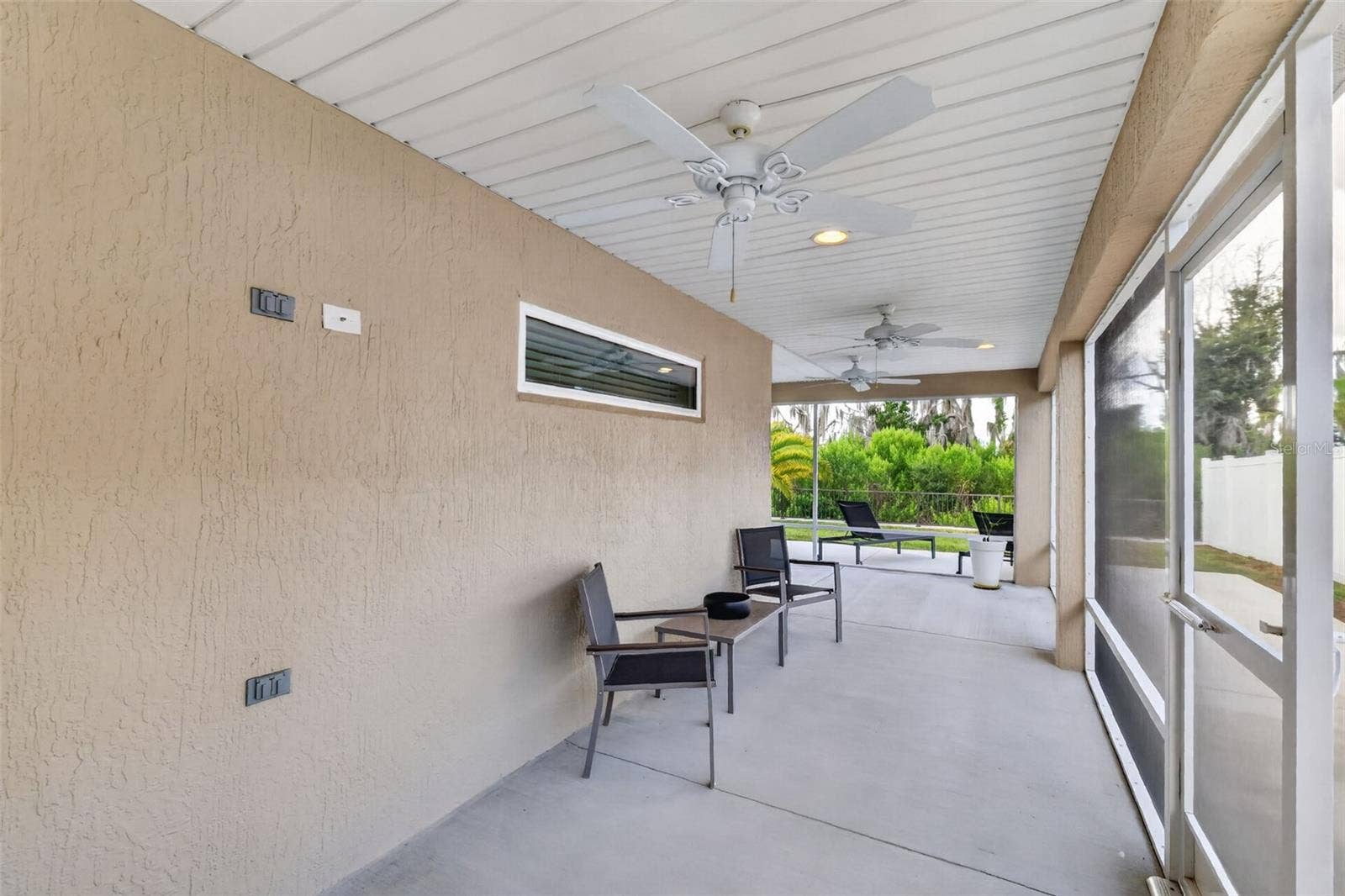 4686 HILES PLACE, The Villages, FL 32163 Lanai with Rear and Side Patios and Serene PRIVATE Preserve Views!