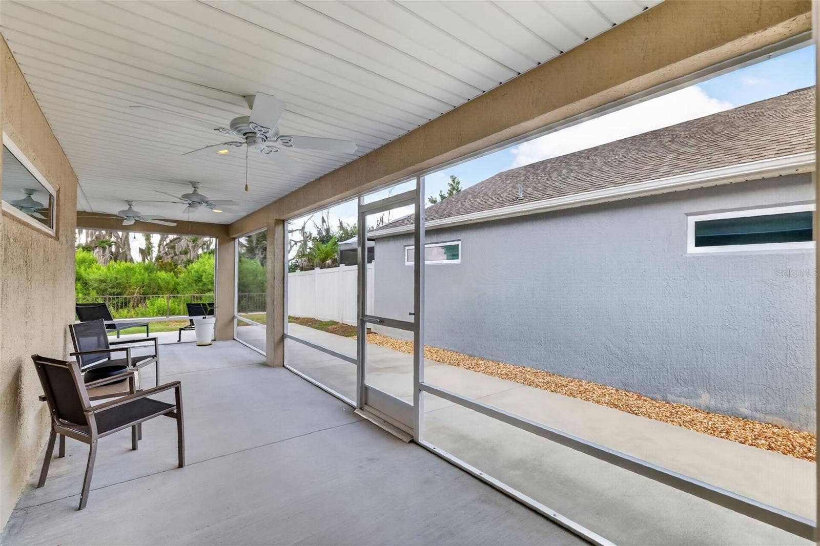 4686 HILES PLACE, The Villages, FL 32163 Lanai with Rear and Side Patios and Serene PRIVATE Preserve Views!