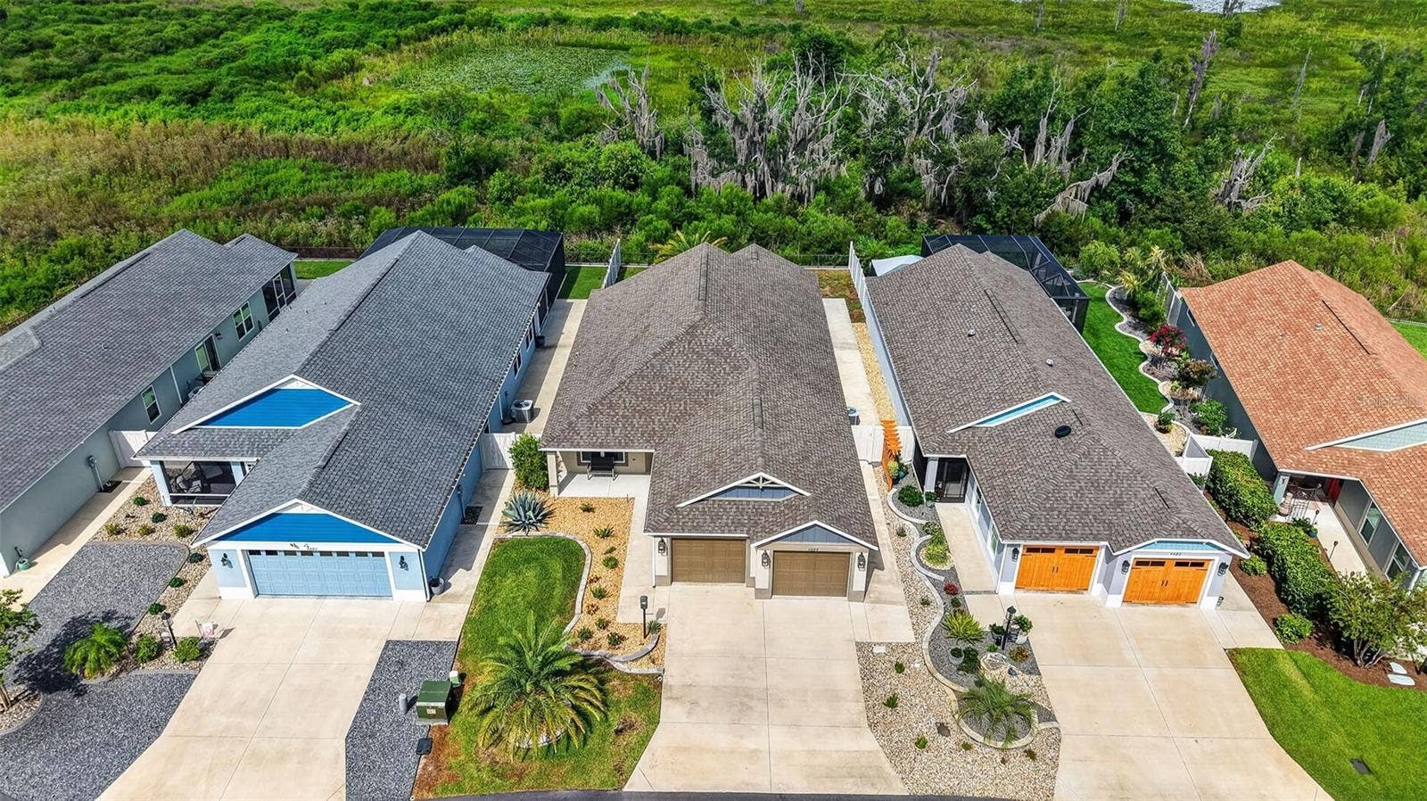 4686 HILES PLACE, The Villages, FL 32163 Front Elevation with Peaceful Preserve and Water Views!