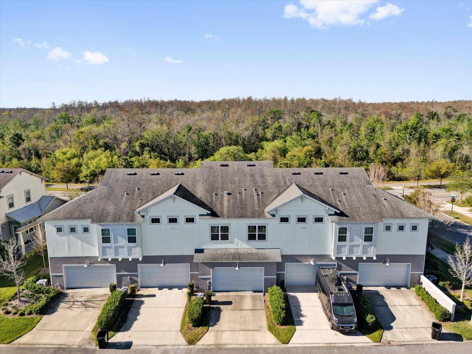 Aerial perspective showcasing the home's architecture and neighborhood setting.