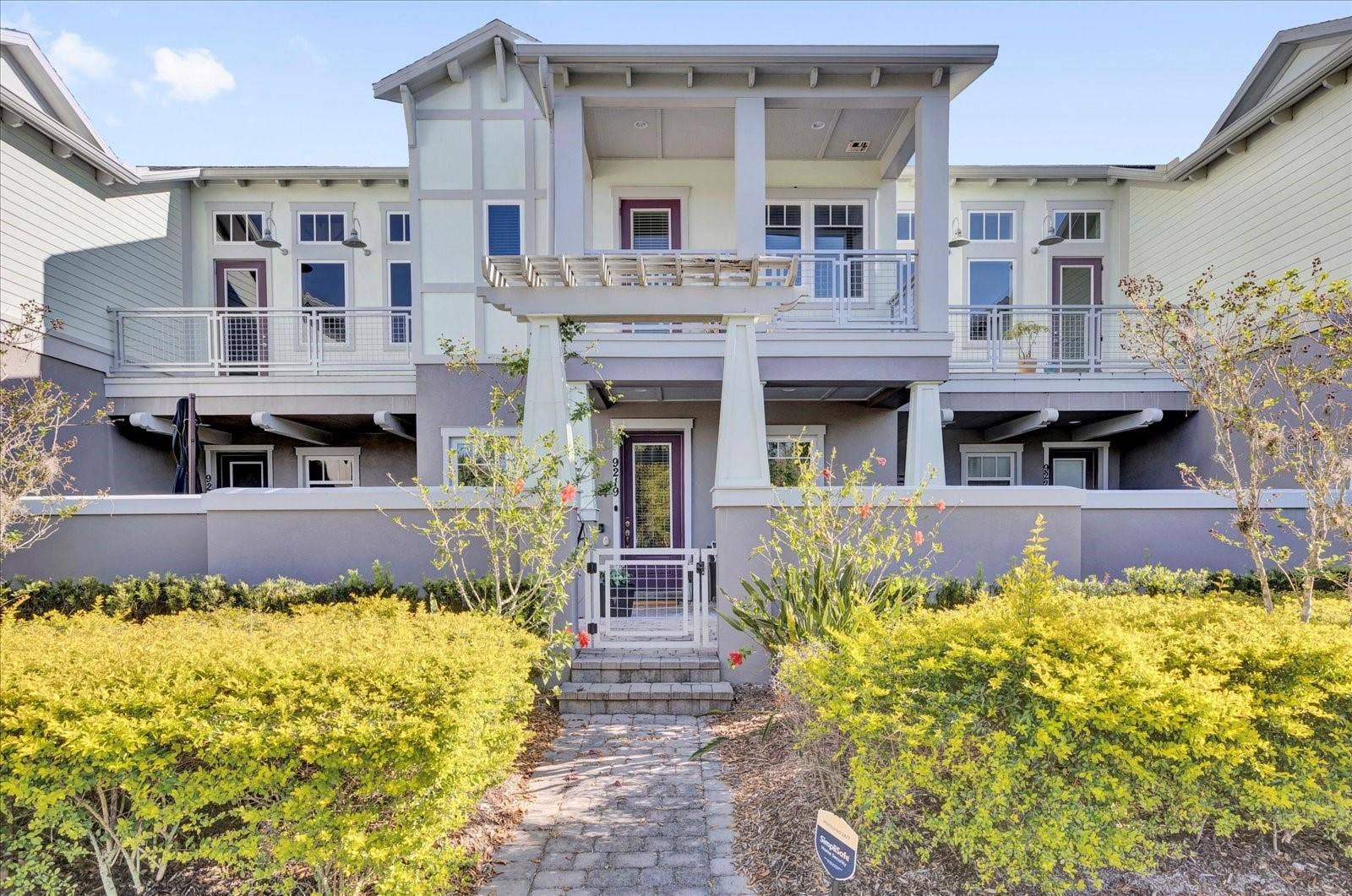Charming Lake Nona townhome with classic curb appeal in the desirable Laureate Park community.