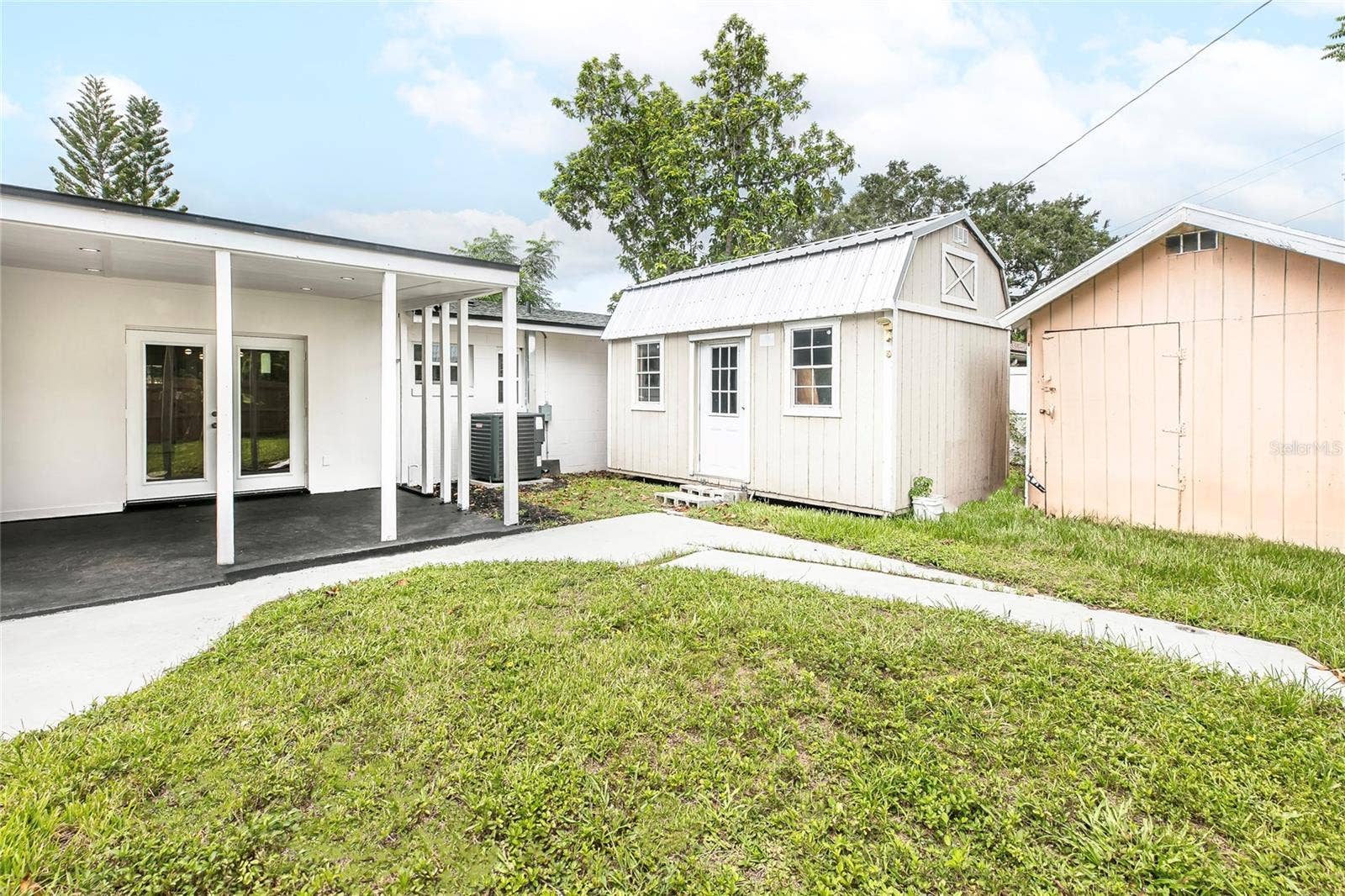 1842 PURITAN AVENUE, Winter Park, FL 32792 back yard with two storage shed