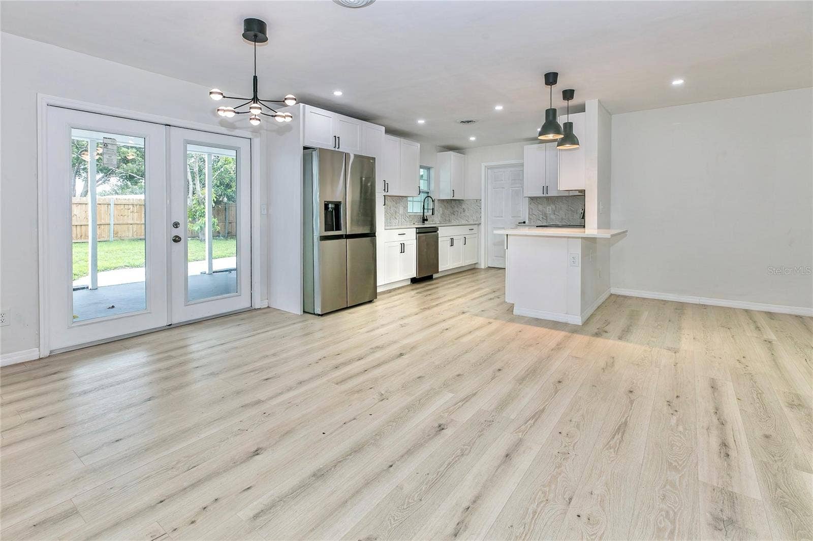1842 PURITAN AVENUE, Winter Park, FL 32792 dining/kitchen and rear entrance door.