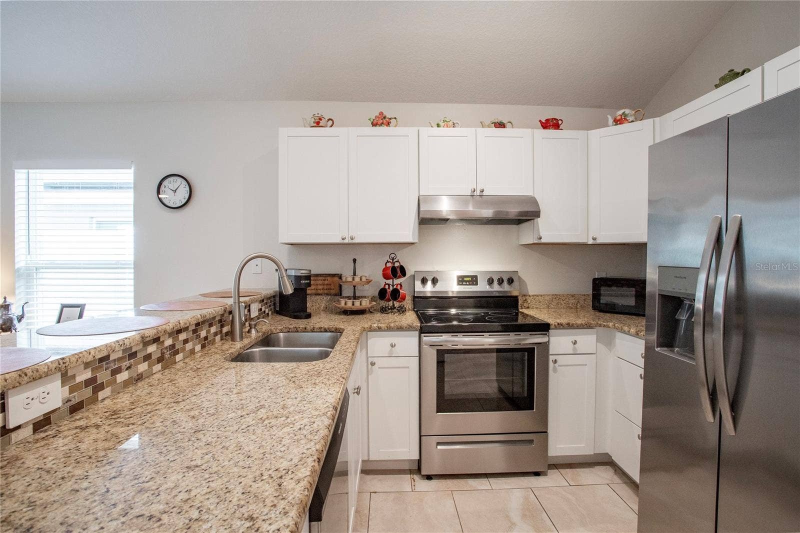 Kitchen with granite countertops and stainless steel appliances
