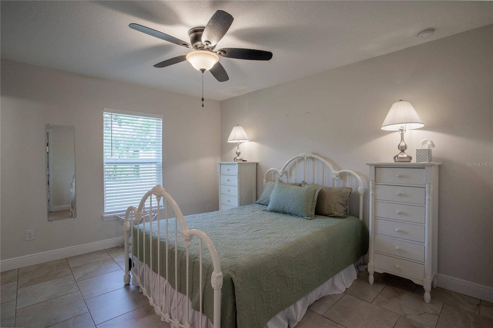 Primary bedroom with walk-in closet