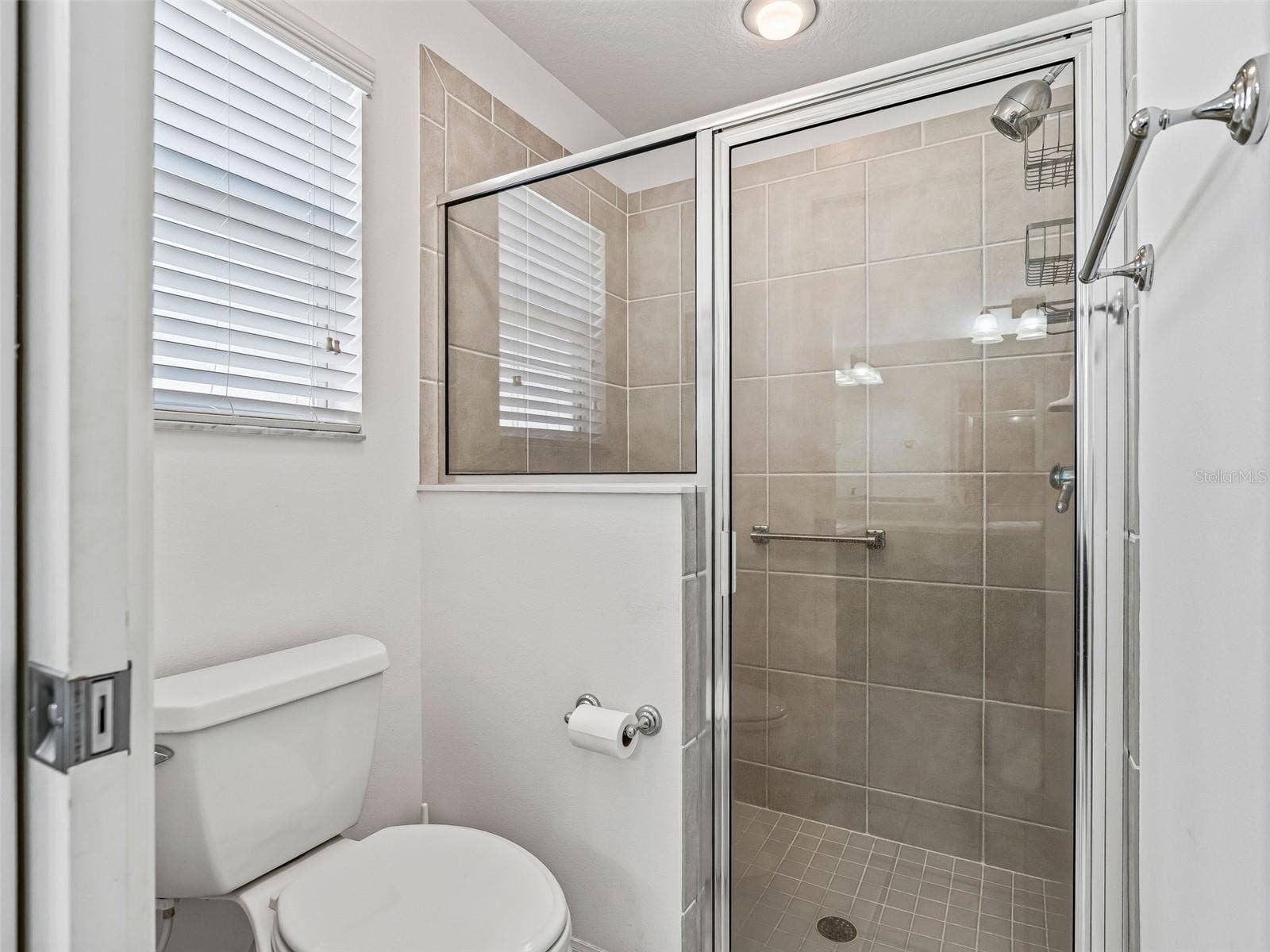 764 BAISLEY TRAIL, The Villages, FL 32162 Primary water closet and walk in shower