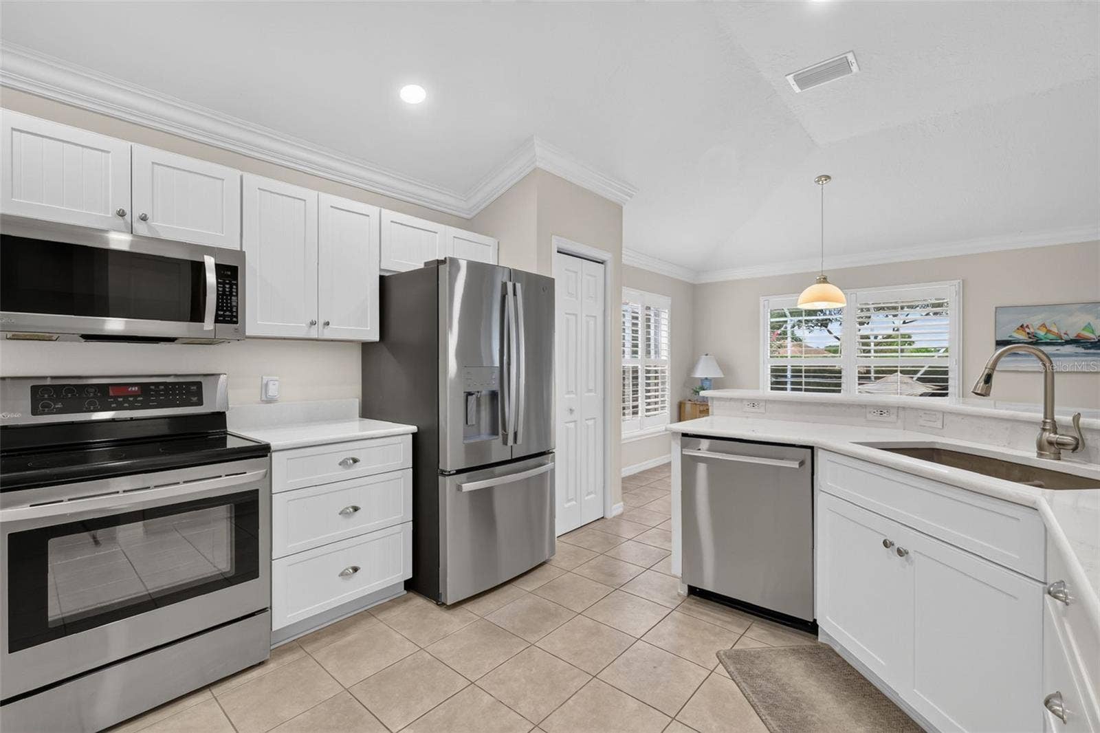 1218 CAMERO DRIVE, Lady Lake, FL 32159 Updated white cabinets and stainless steel appliances