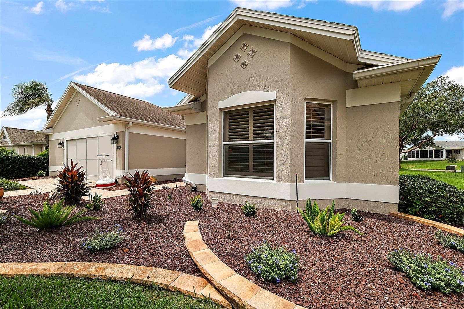 1218 CAMERO DRIVE, Lady Lake, FL 32159 Lovely landscaping surrounding the home.
