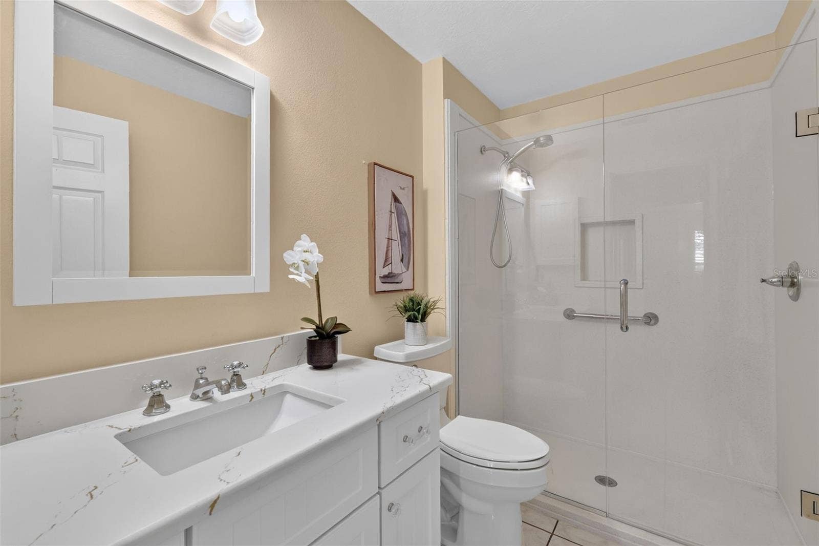 1218 CAMERO DRIVE, Lady Lake, FL 32159 Guest bathroom with walk in shower and Quartz countertop
