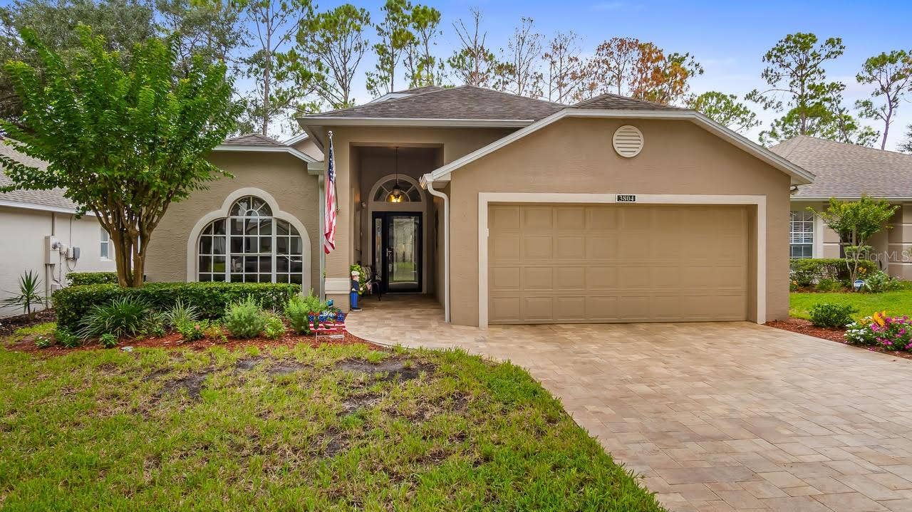 Front With Paver Driveway and Walkway