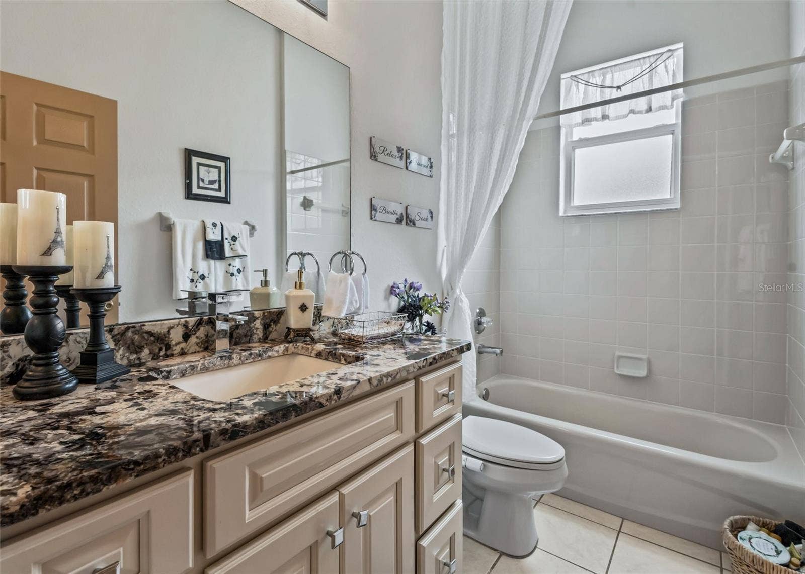 Guest bathroom w/Granite Topped Vanity, Tiled Tub & Shower Combination
