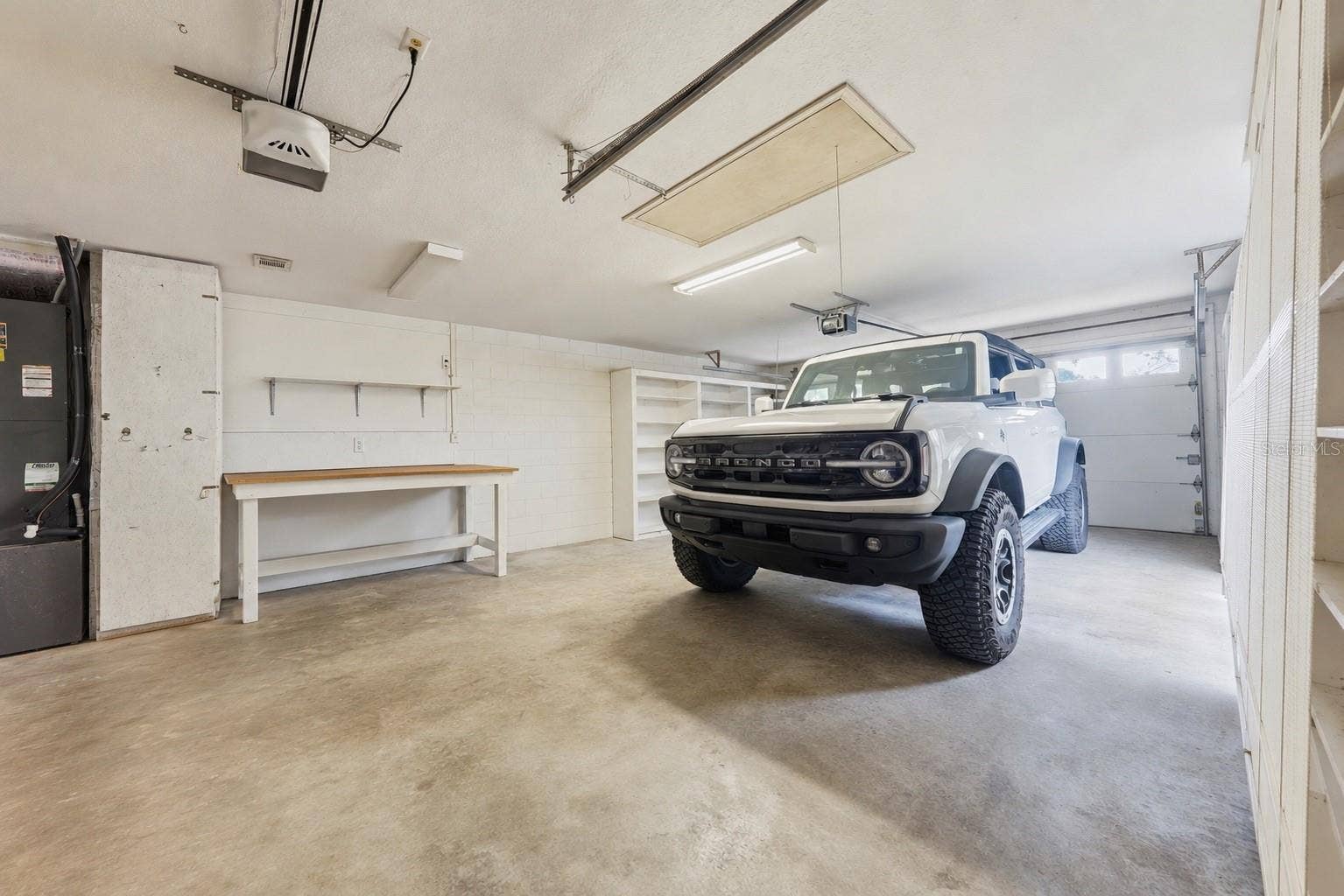 2360 PARK FOREST BOULEVARD, Mount Dora, FL 32757 Oversized garage with a dedicated golf cart door.