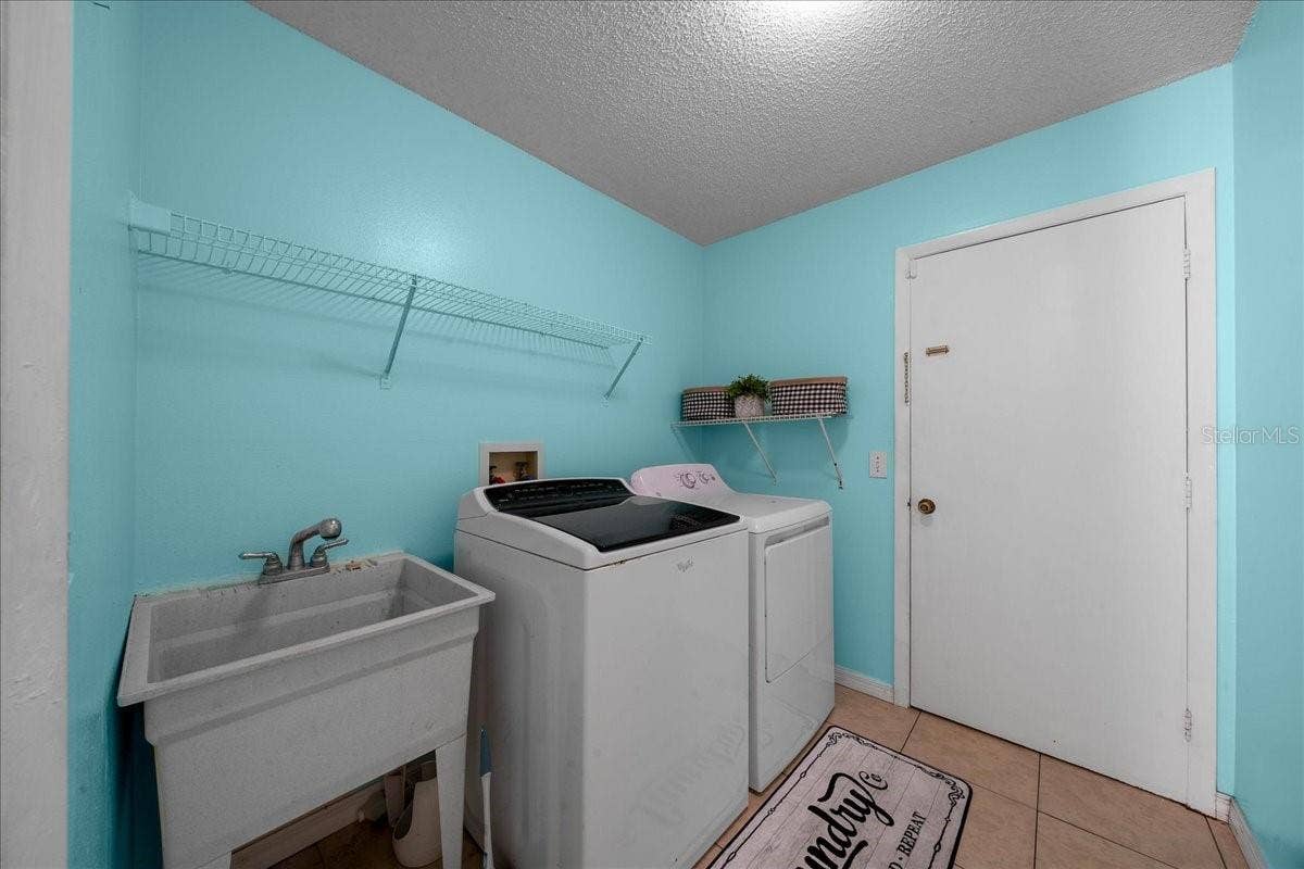 14993 SW 38TH CIRCLE, Ocala, FL 34473 Laundry Room features Utility Sink