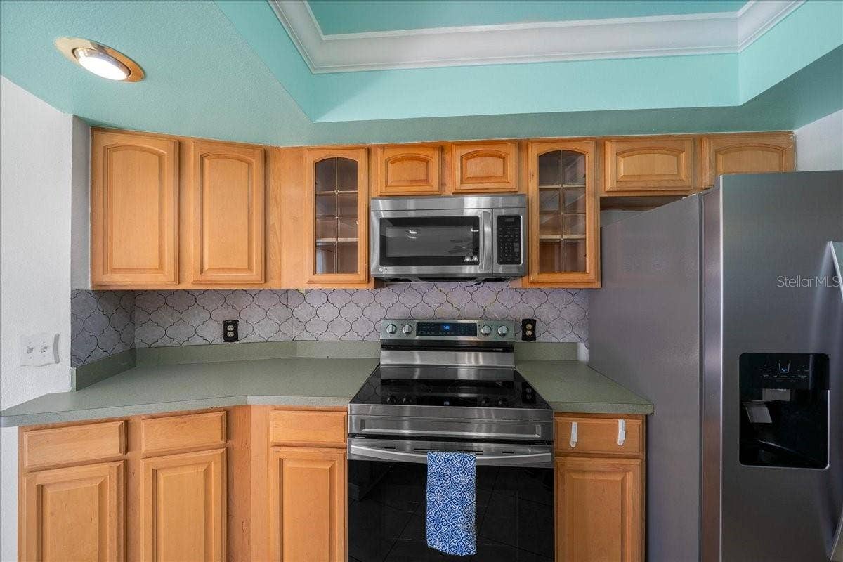 14993 SW 38TH CIRCLE, Ocala, FL 34473 Stainless Steel Stove, Microwave, & Fridge