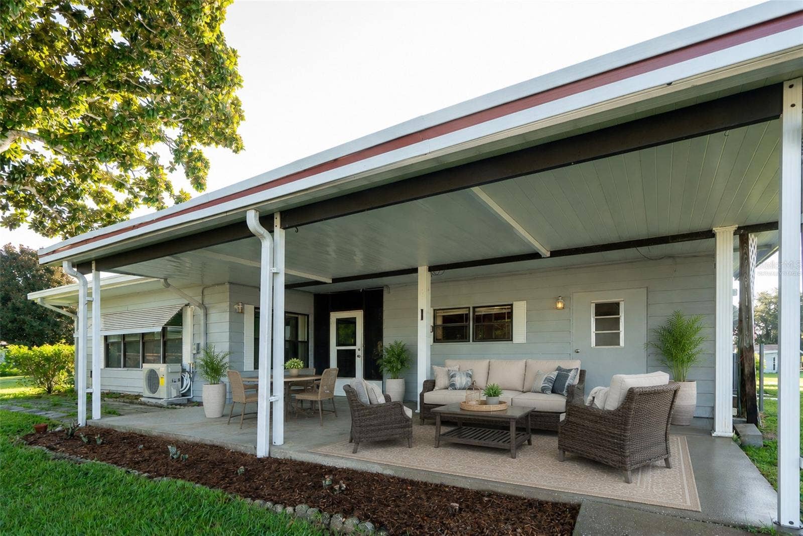 1021 HILLTOP ROAD, Tavares, FL 32778 Backporch virtually staged
