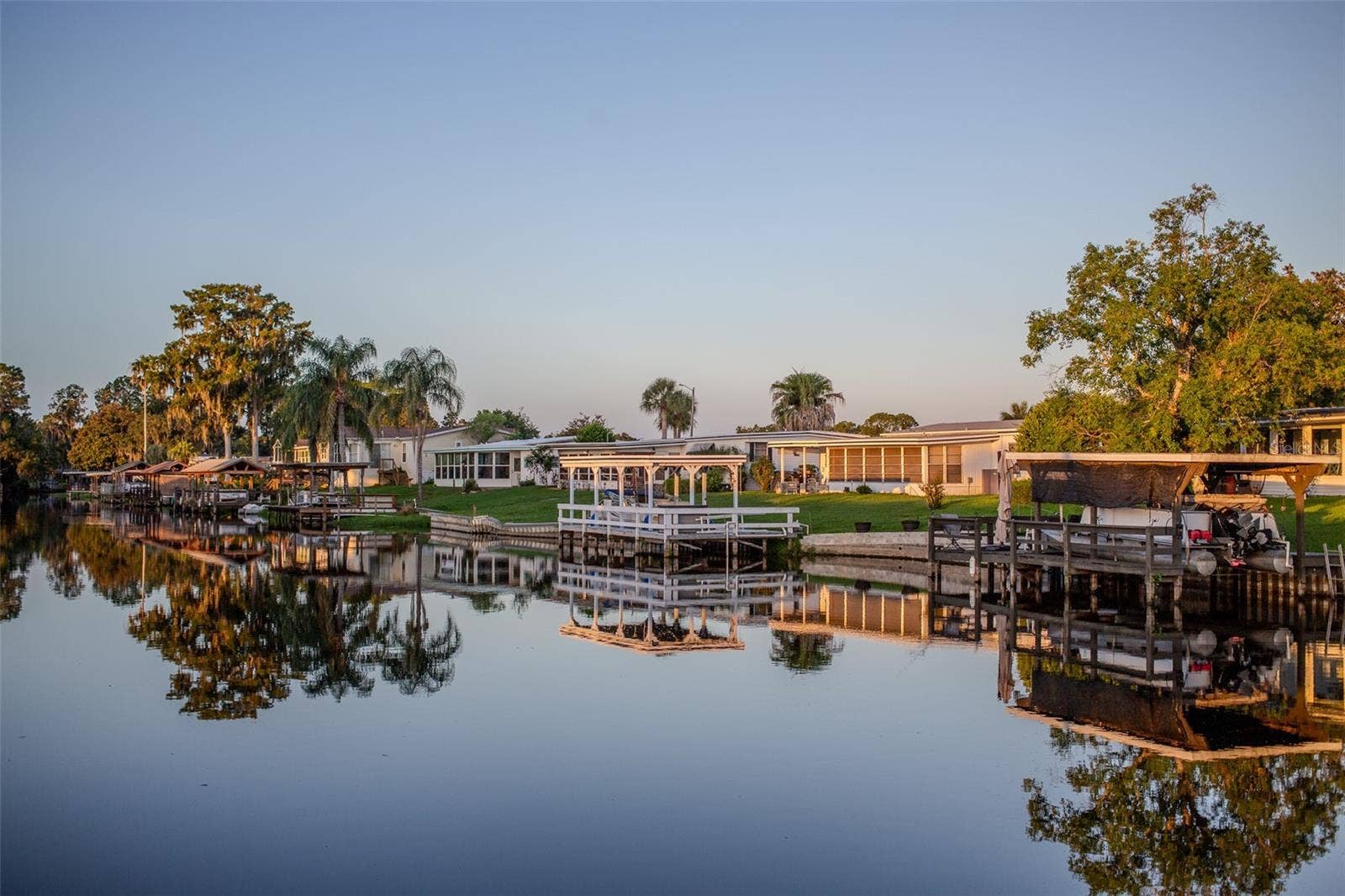 1021 HILLTOP ROAD, Tavares, FL 32778 Sunrise Canal View