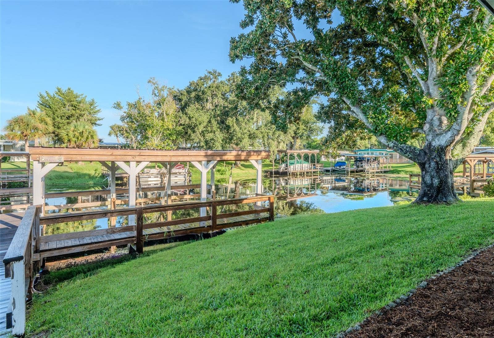1021 HILLTOP ROAD, Tavares, FL 32778 Canal view from back porch