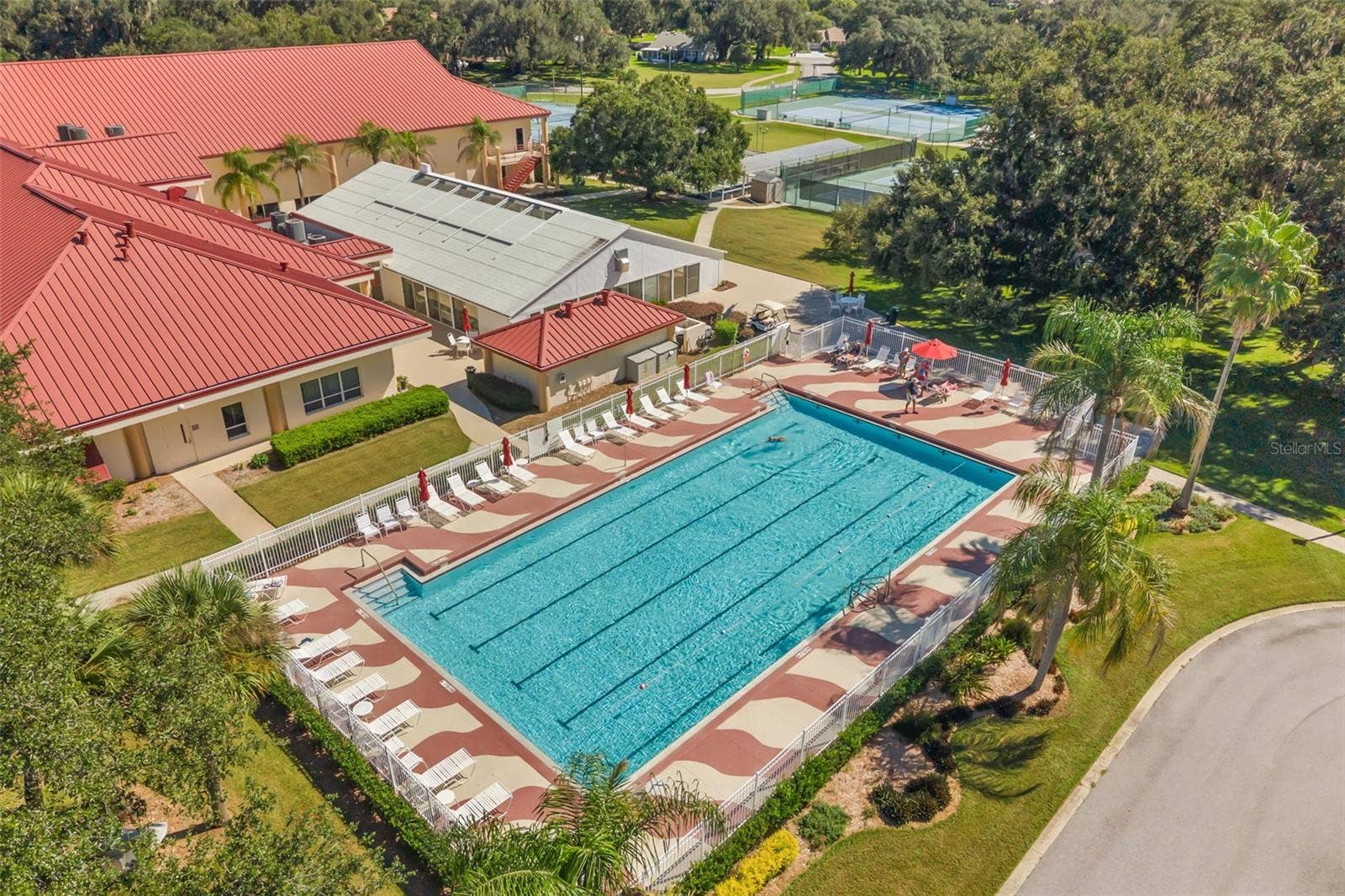 Clubhouse with outdoor pool, tennis, pickle ball and bocce ball courts