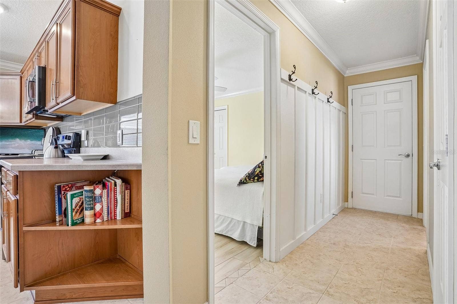 583 ARTEAGA WAY, The Villages, FL 32162 Hallway to Garage, 2nd Bath, 3rd Bedroom