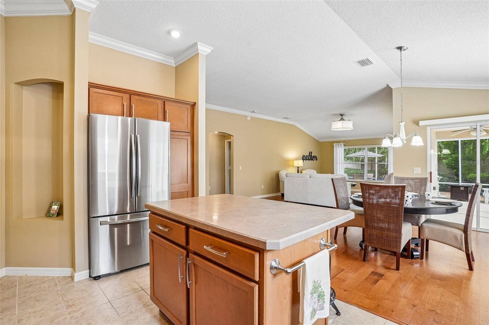583 ARTEAGA WAY, The Villages, FL 32162 Kitchen Island into Dining Room