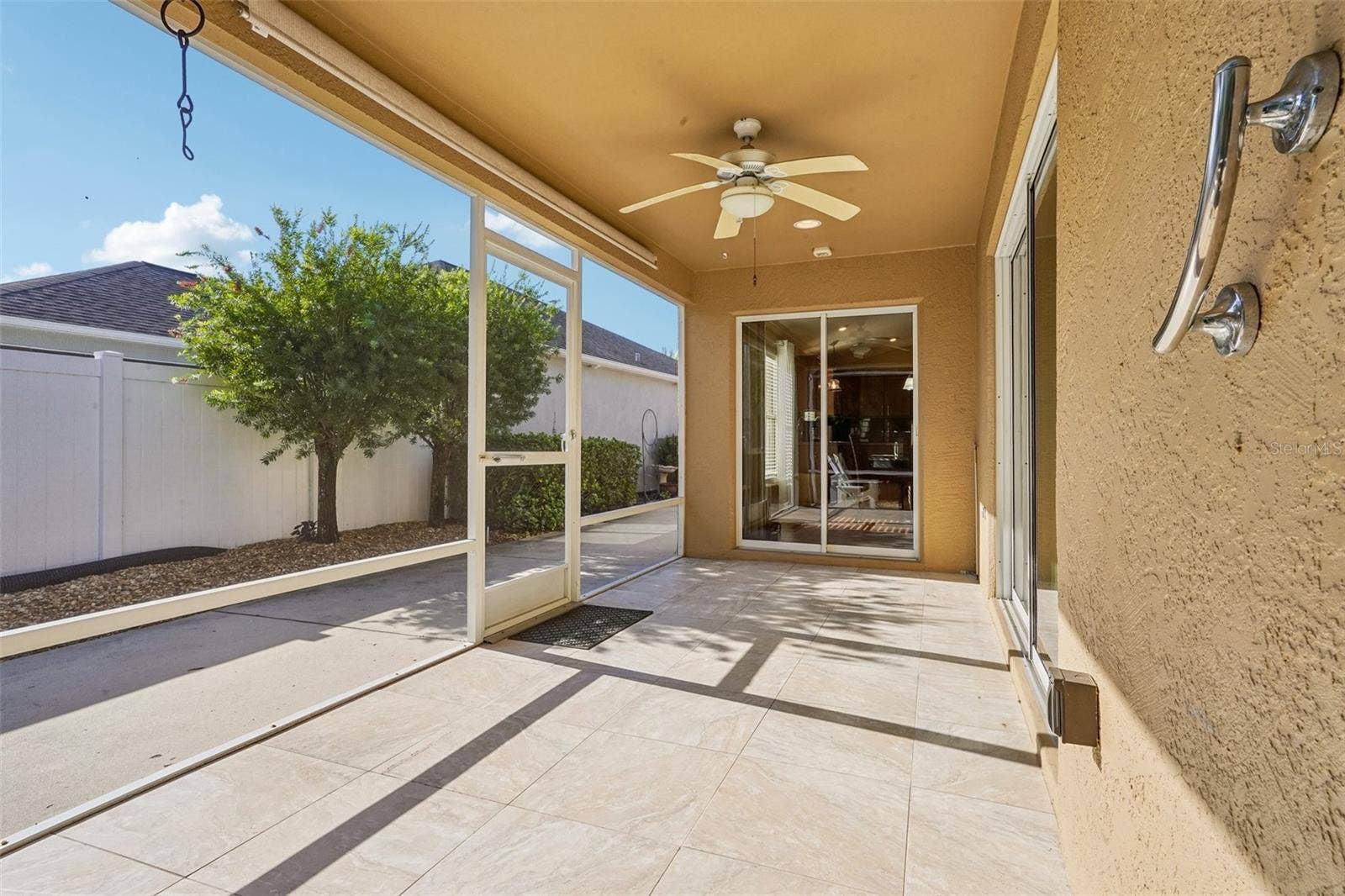 583 ARTEAGA WAY, The Villages, FL 32162 Half of the Enclosed Lanai