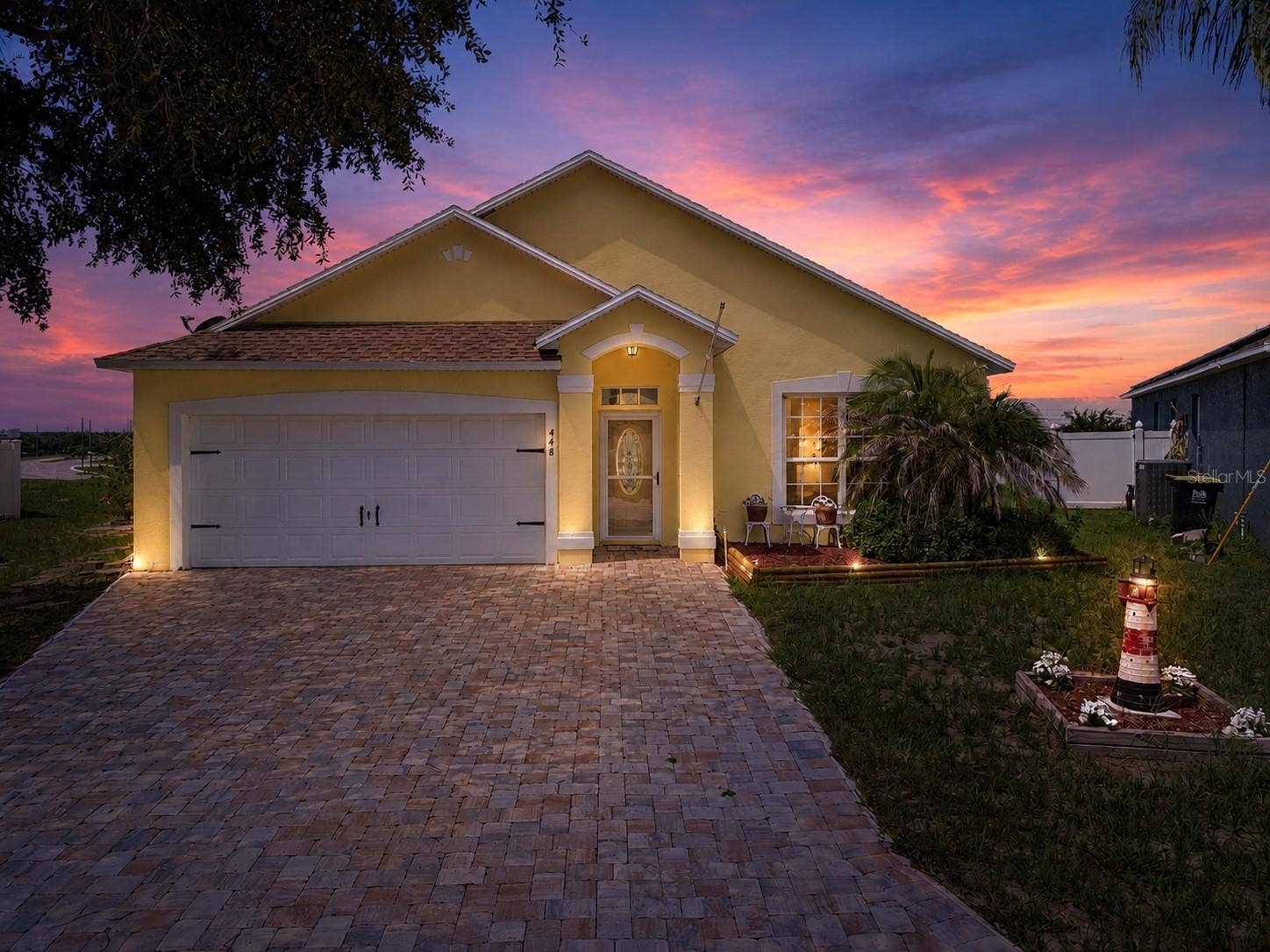 448 COTSWOLD CIRCLE, Davenport, FL 33837 Exterior Front Twilight