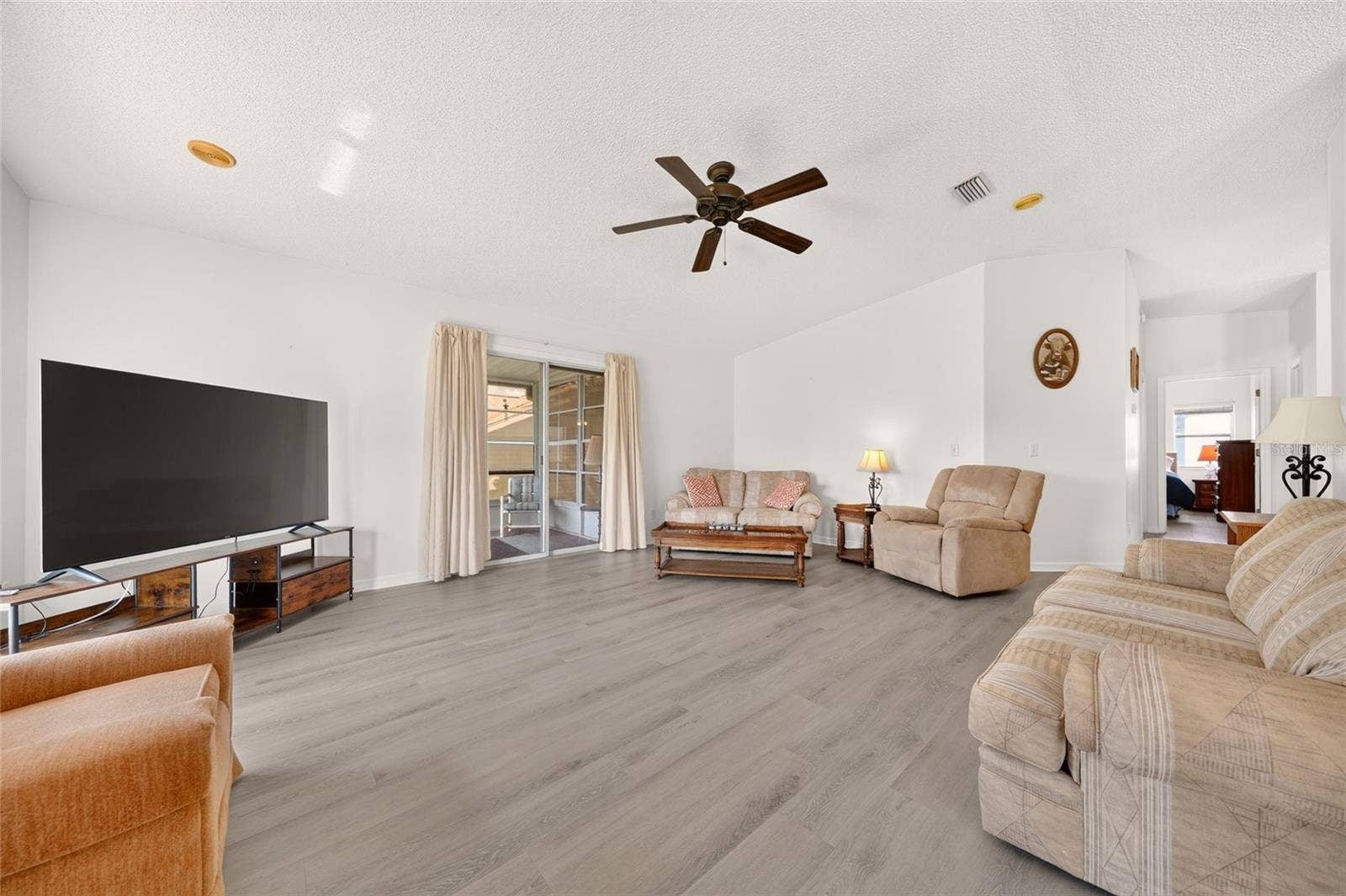 1207 PALMETTO DRIVE, The Villages, FL 32159 Living Room Slider to Lanai