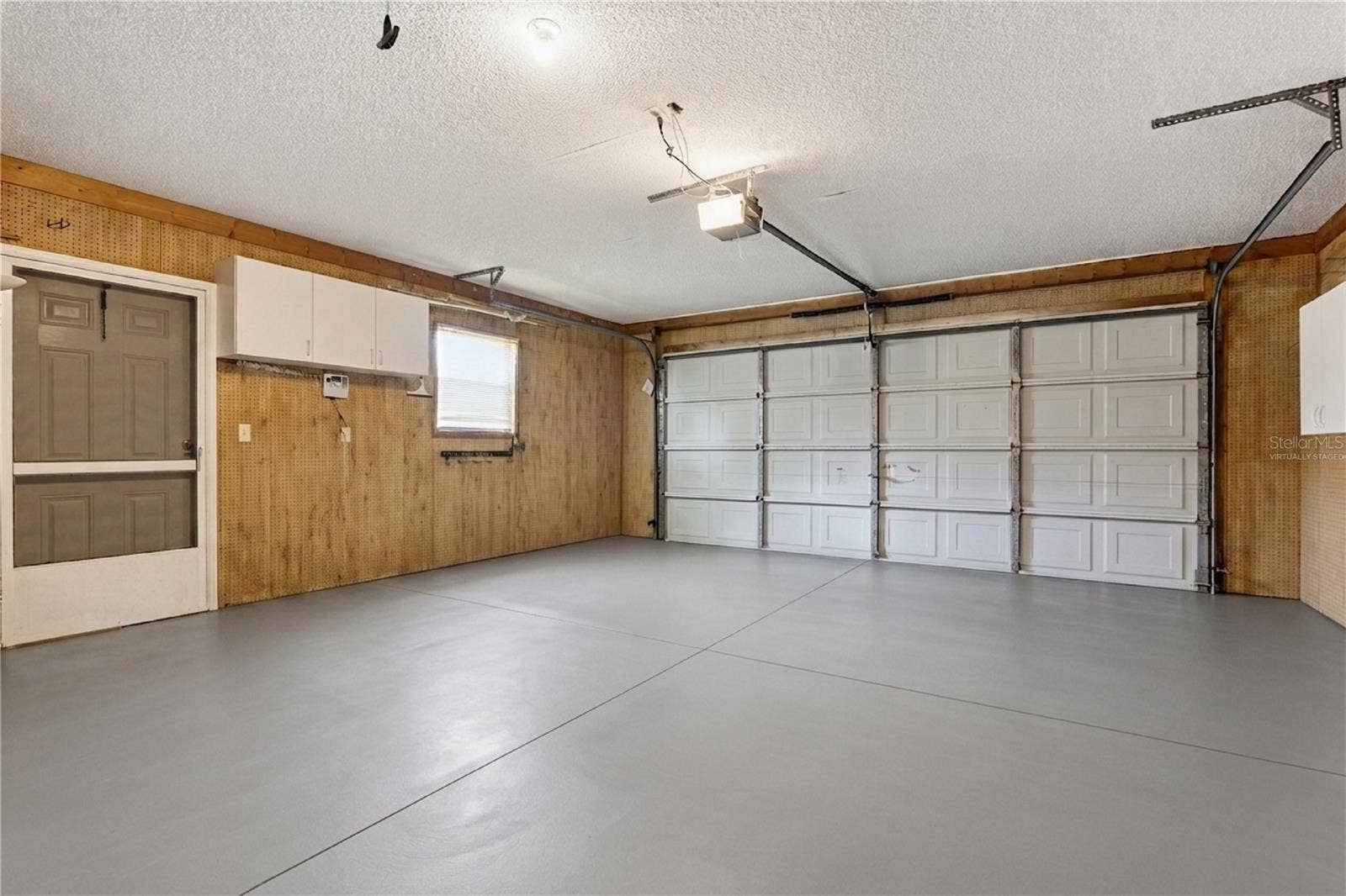 26744 RACQUET CIRCLE, Leesburg, FL 34748 Front of Garage - Virtually Staged