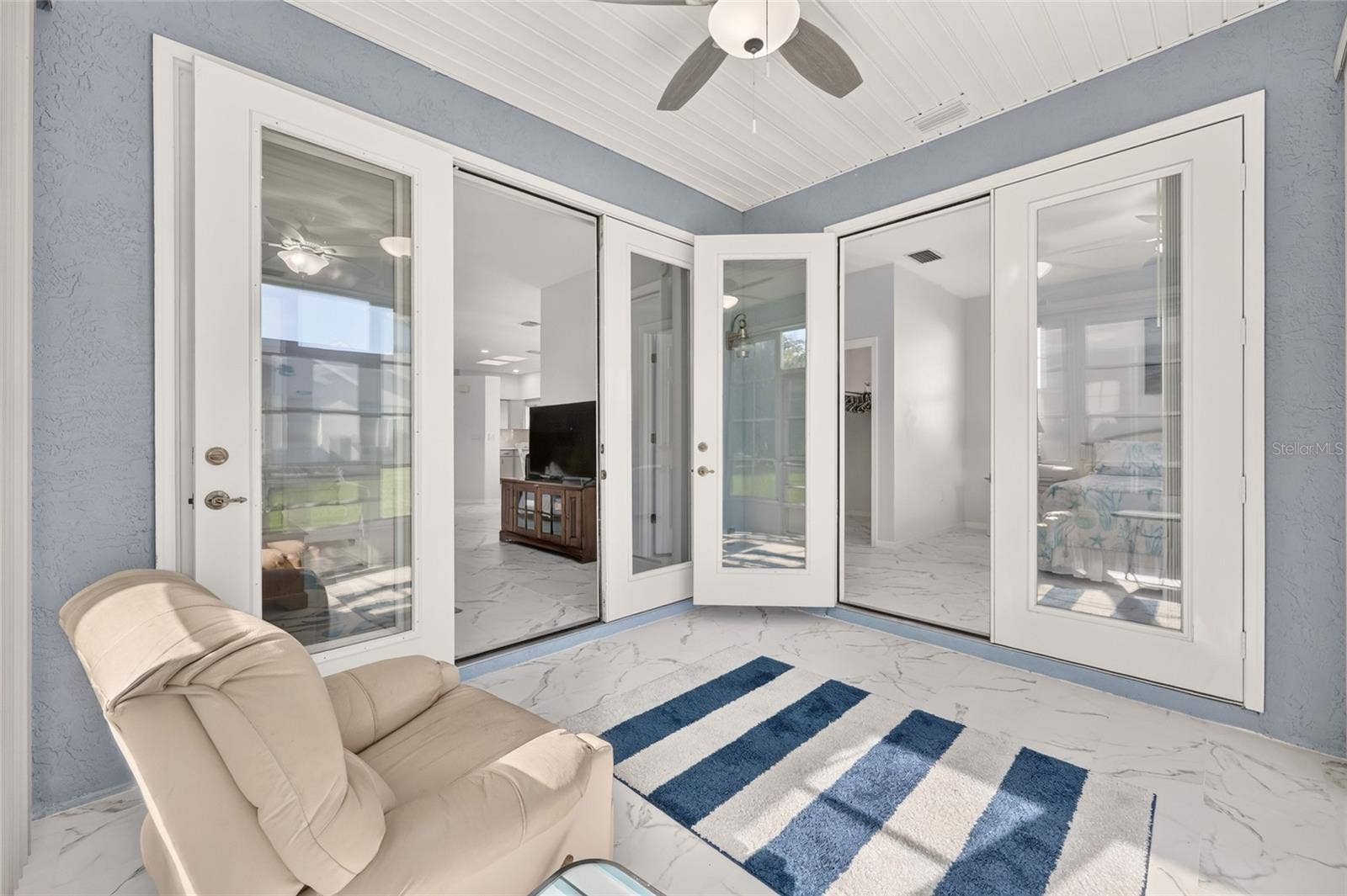 FRENCH DOORS INTO LIVING ROOM AND PRIMARY SUITE
