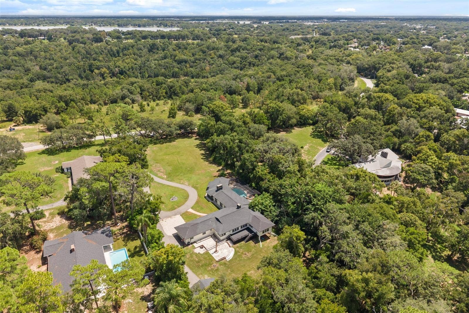 Aerial from back of property with several nearby lakes in view