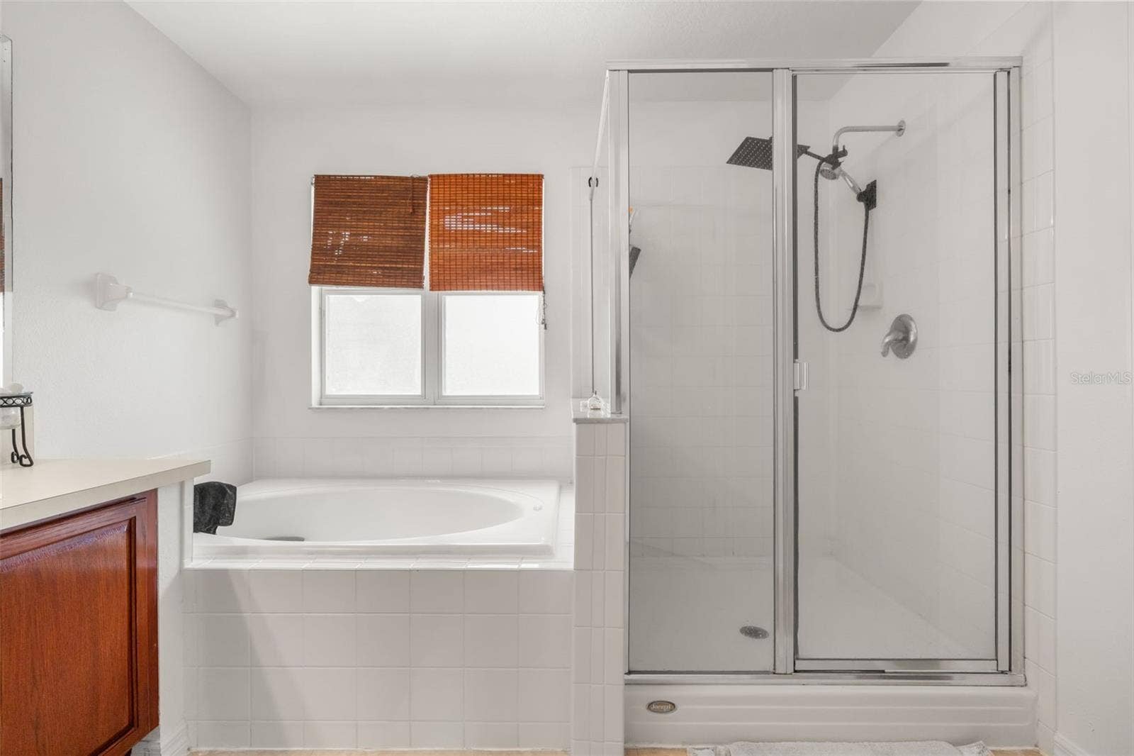211 HUNT STREET, Clermont, FL 34711 Additional primary bathroom view featuring a glass-enclosed shower and clean, neutral finishes.