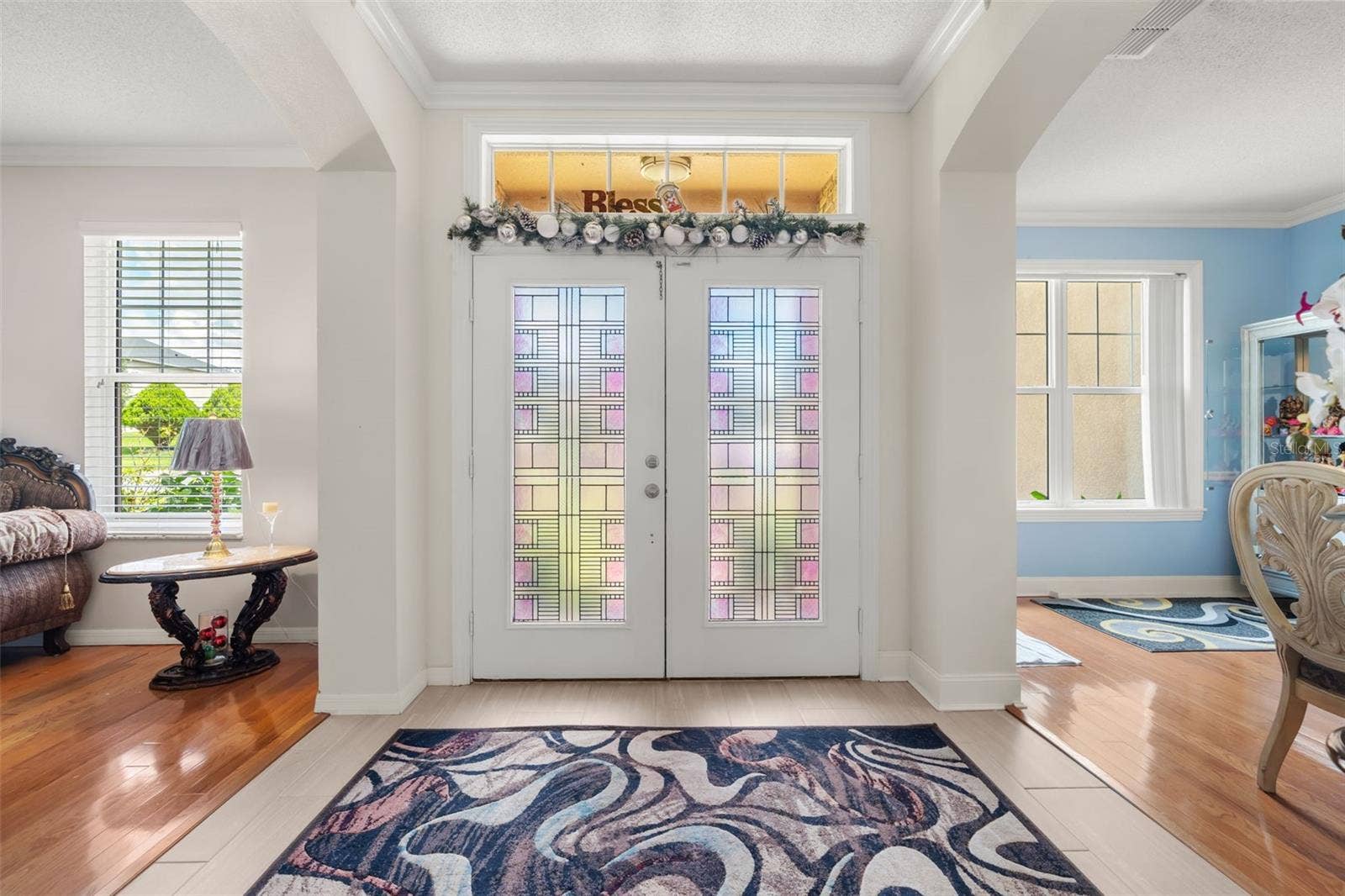 211 HUNT STREET, Clermont, FL 34711 Bright entryway with double doors and plenty of natural light.