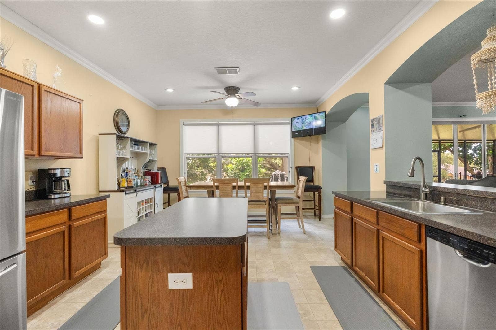211 HUNT STREET, Clermont, FL 34711 Well-equipped kitchen with center island, ample cabinetry, and generous counter space.