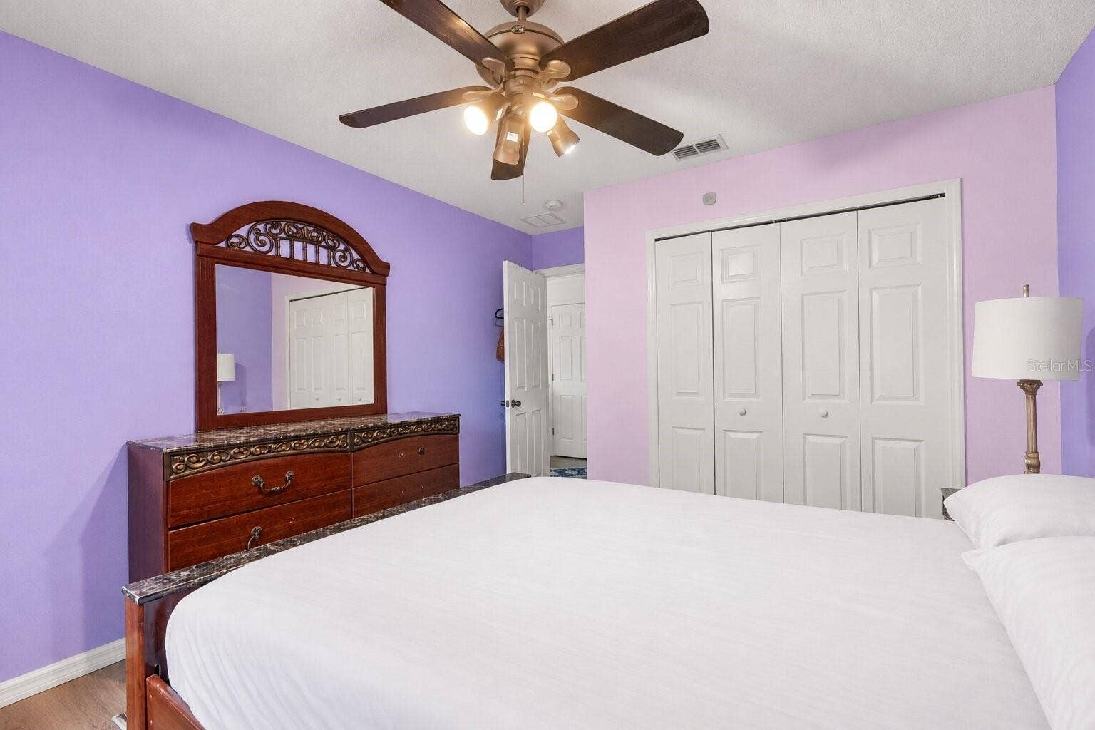 211 HUNT STREET, Clermont, FL 34711 Additional bedroom view highlighting the rooms spacious layout.