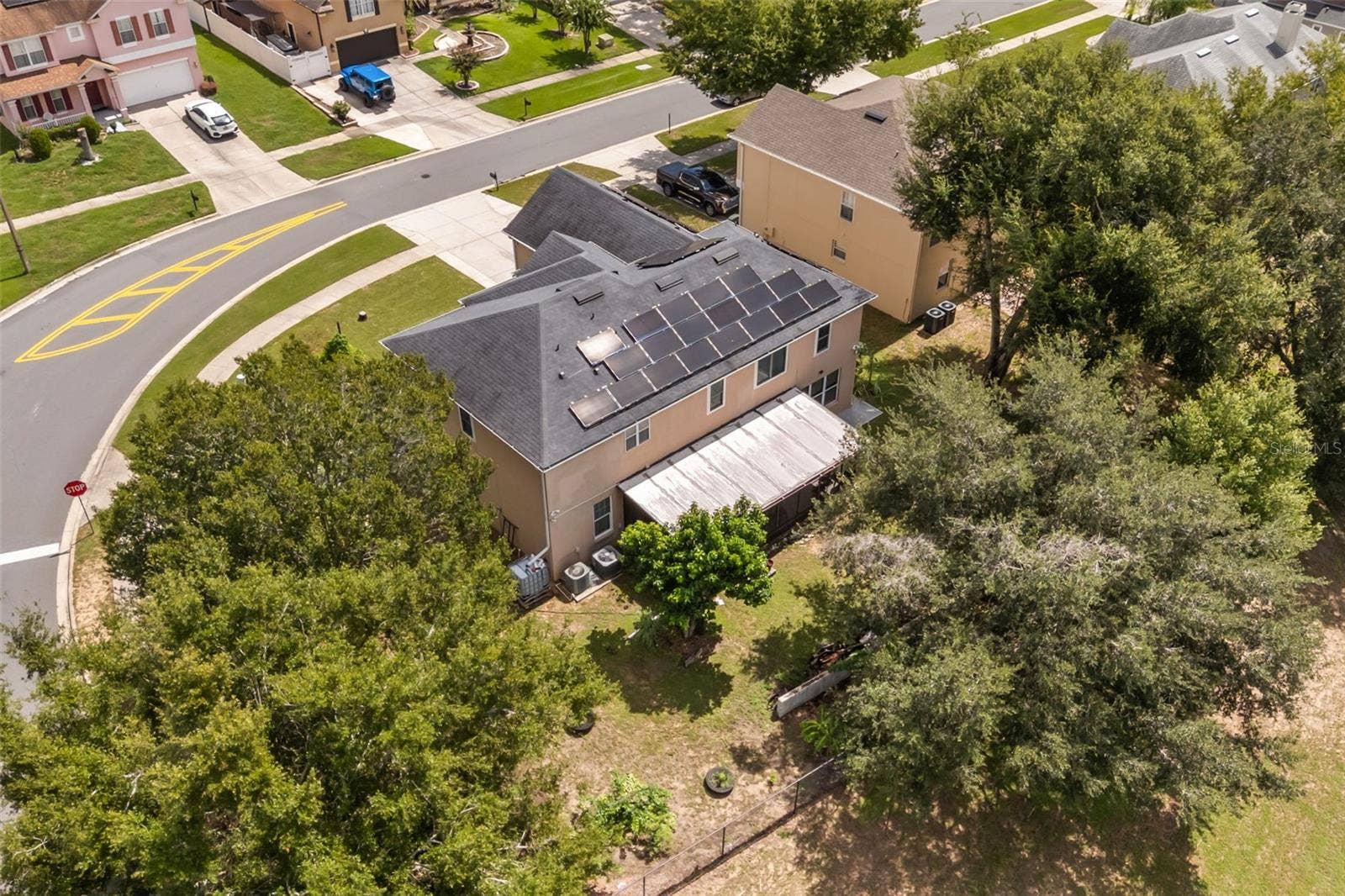 211 HUNT STREET, Clermont, FL 34711 Aerial view showing the home, yard, and surrounding area.