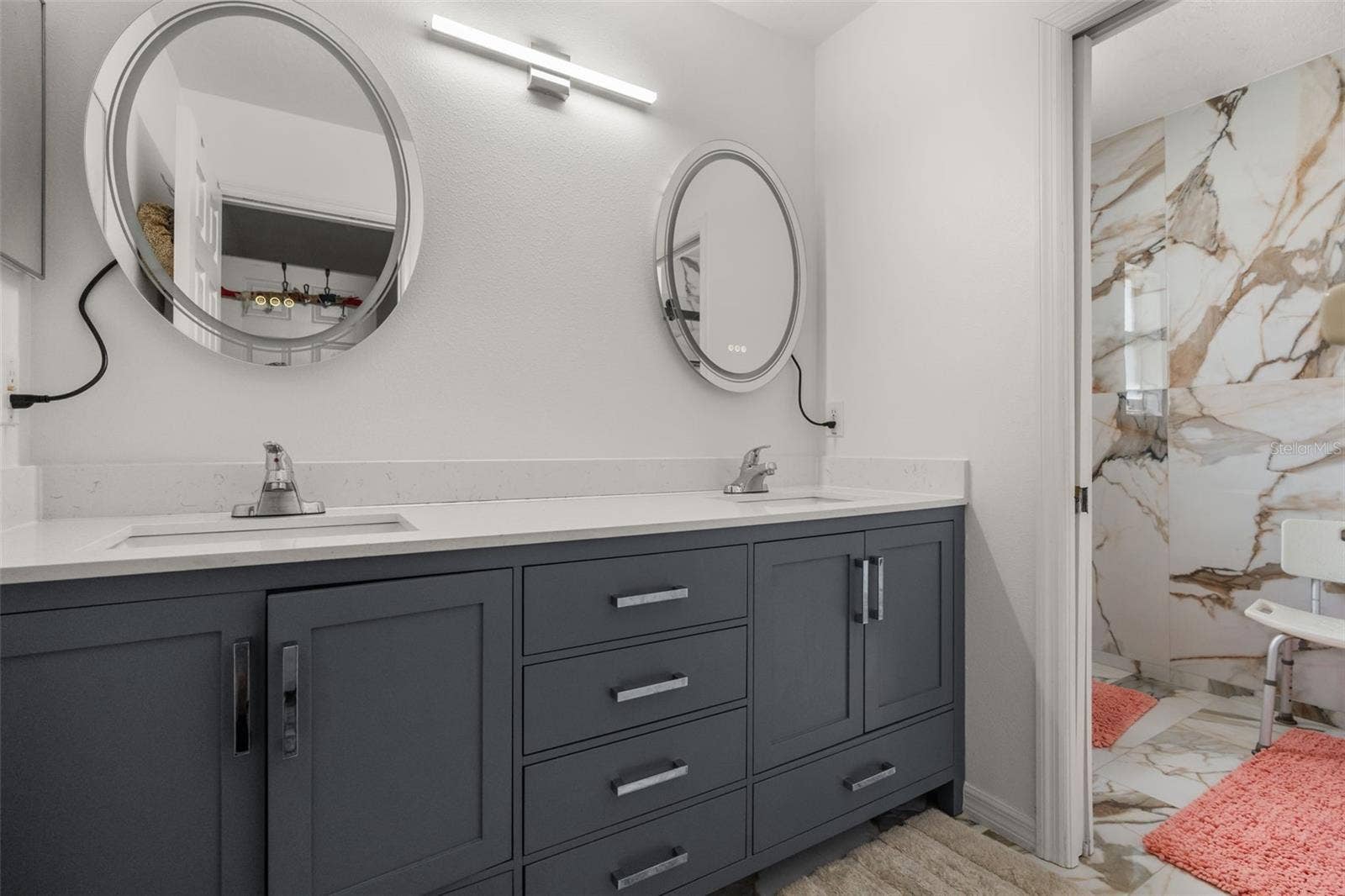 211 HUNT STREET, Clermont, FL 34711 Bathroom vanity with ample storage and updated finishes.