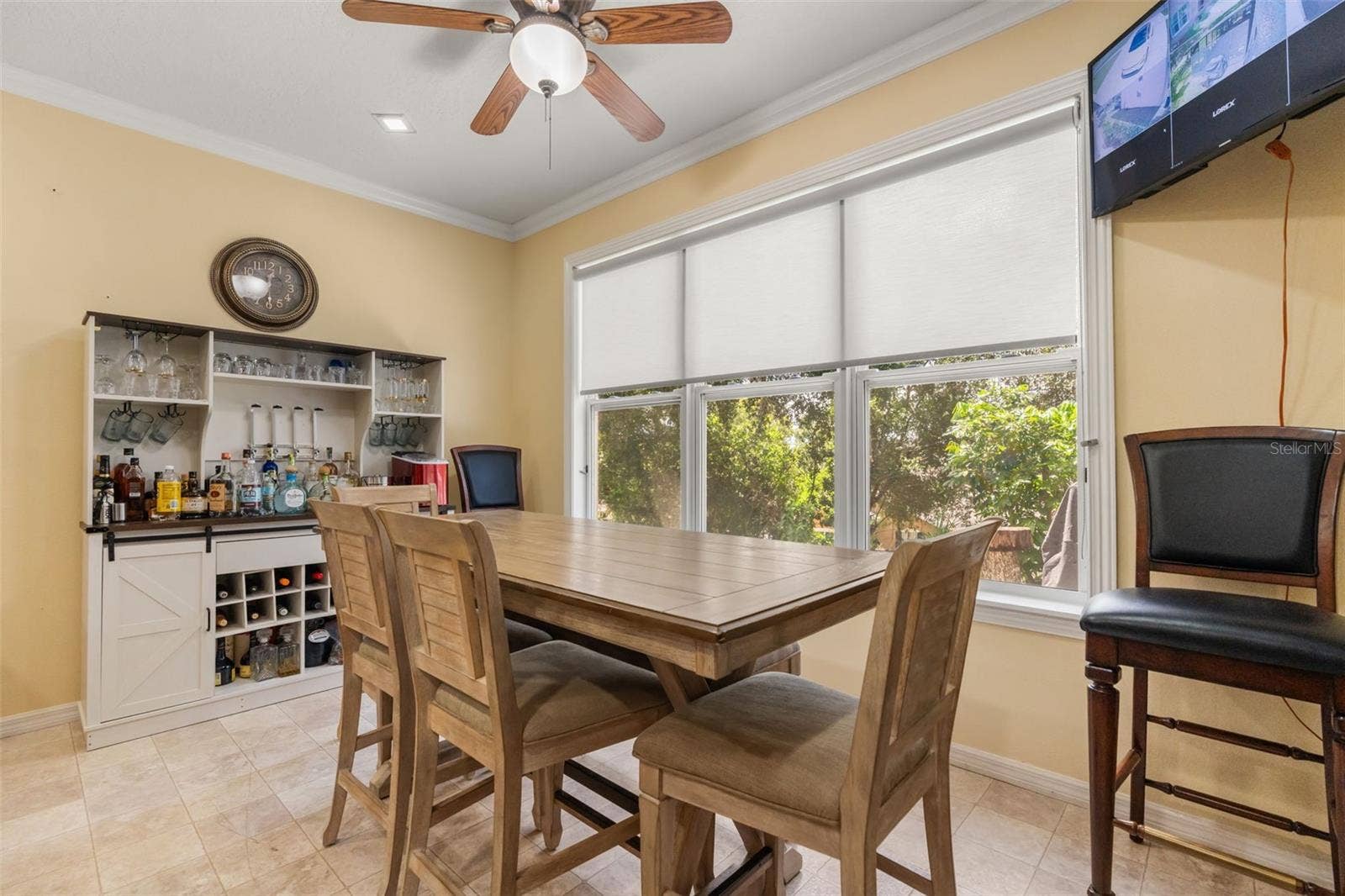 211 HUNT STREET, Clermont, FL 34711 Bright breakfast nook with a built-in coffee bar, large windows, and plenty of natural light.